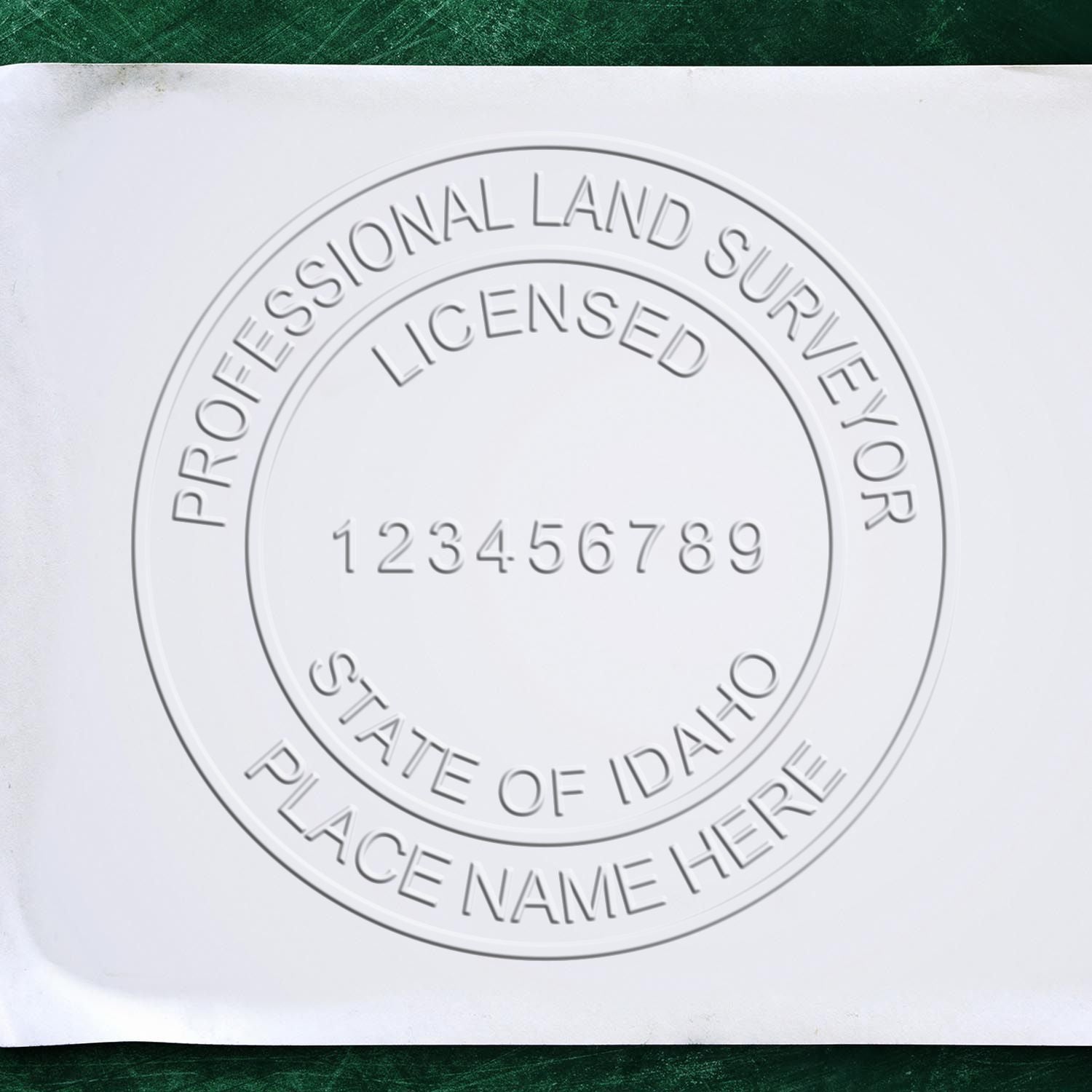 The main image for the Idaho Desk Surveyor Seal Embosser depicting a sample of the imprint and electronic files
