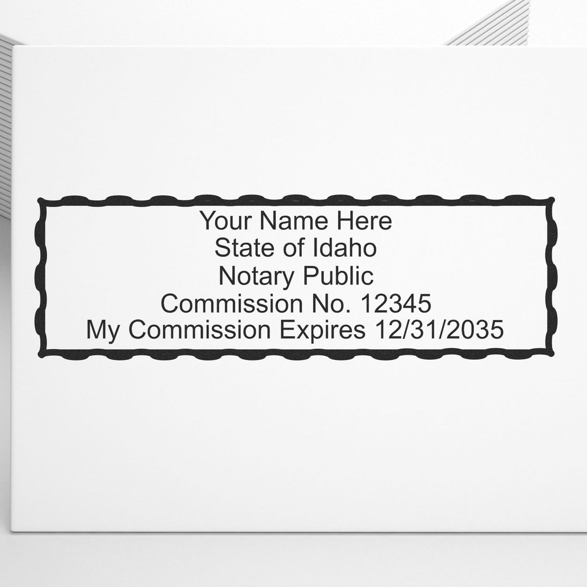 A lifestyle photo showing a stamped image of the Heavy-Duty Idaho Rectangular Notary Stamp on a piece of paper