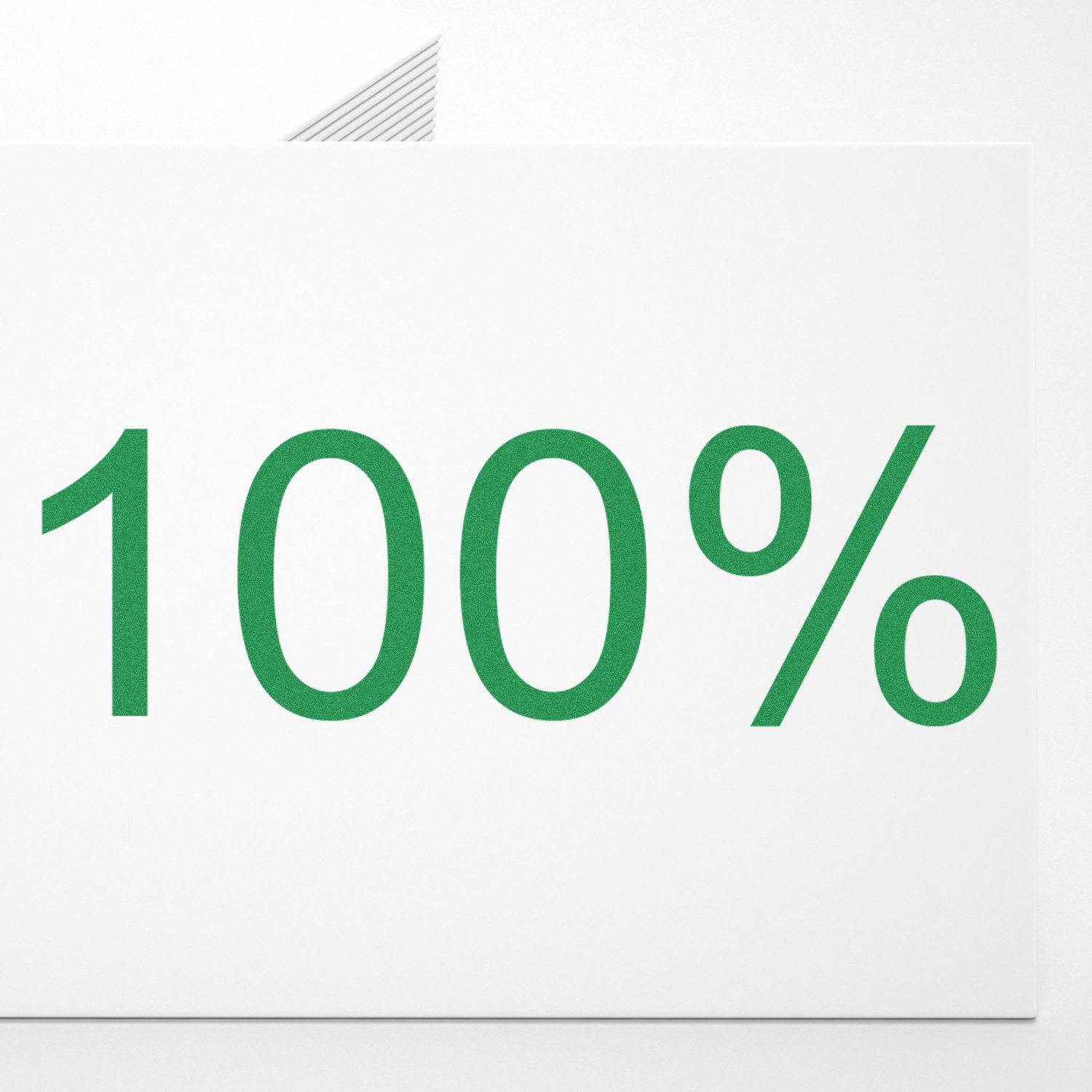 Large Pre-Inked 100% Stamp in use, showing a crisp, green 100% impression on a white sheet of paper.