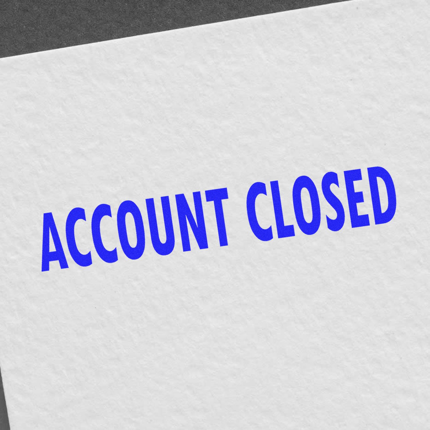 Account Closed rubber stamp in blue ink on white paper, indicating the closure of an account.