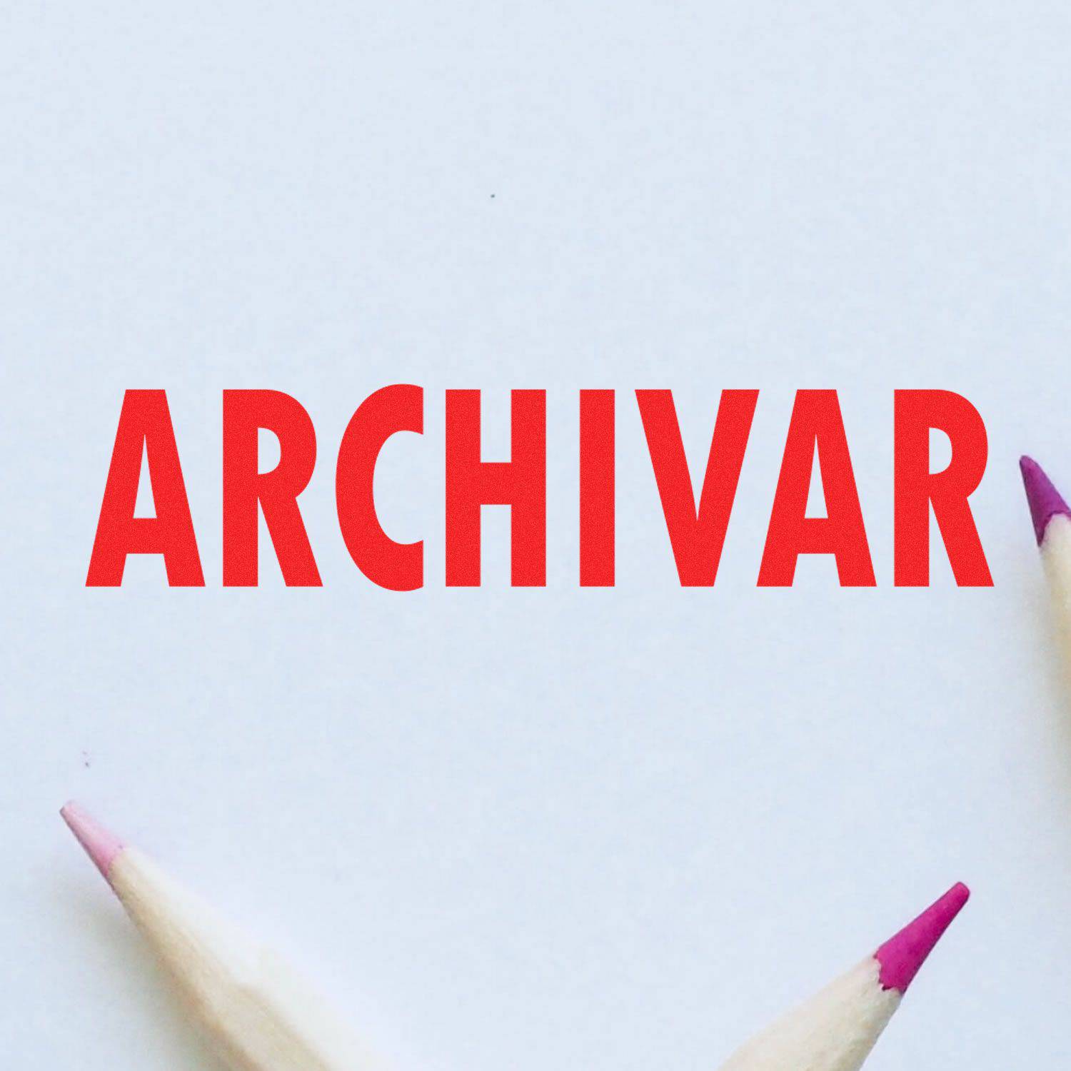 Large Pre-Inked Archivar Stamp in red ink on white paper, surrounded by three sharpened pencils with colored tips.
