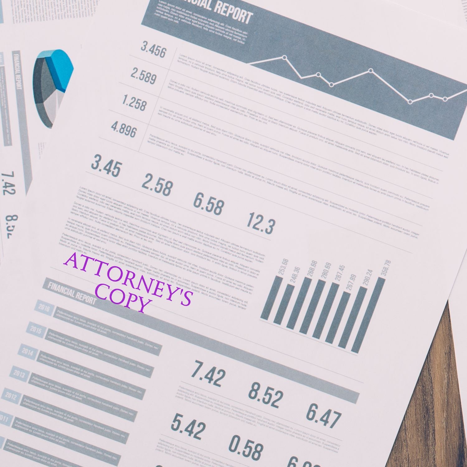 Slim Pre-Inked Attorney's Copy Stamp in purple ink on financial documents with charts and graphs.