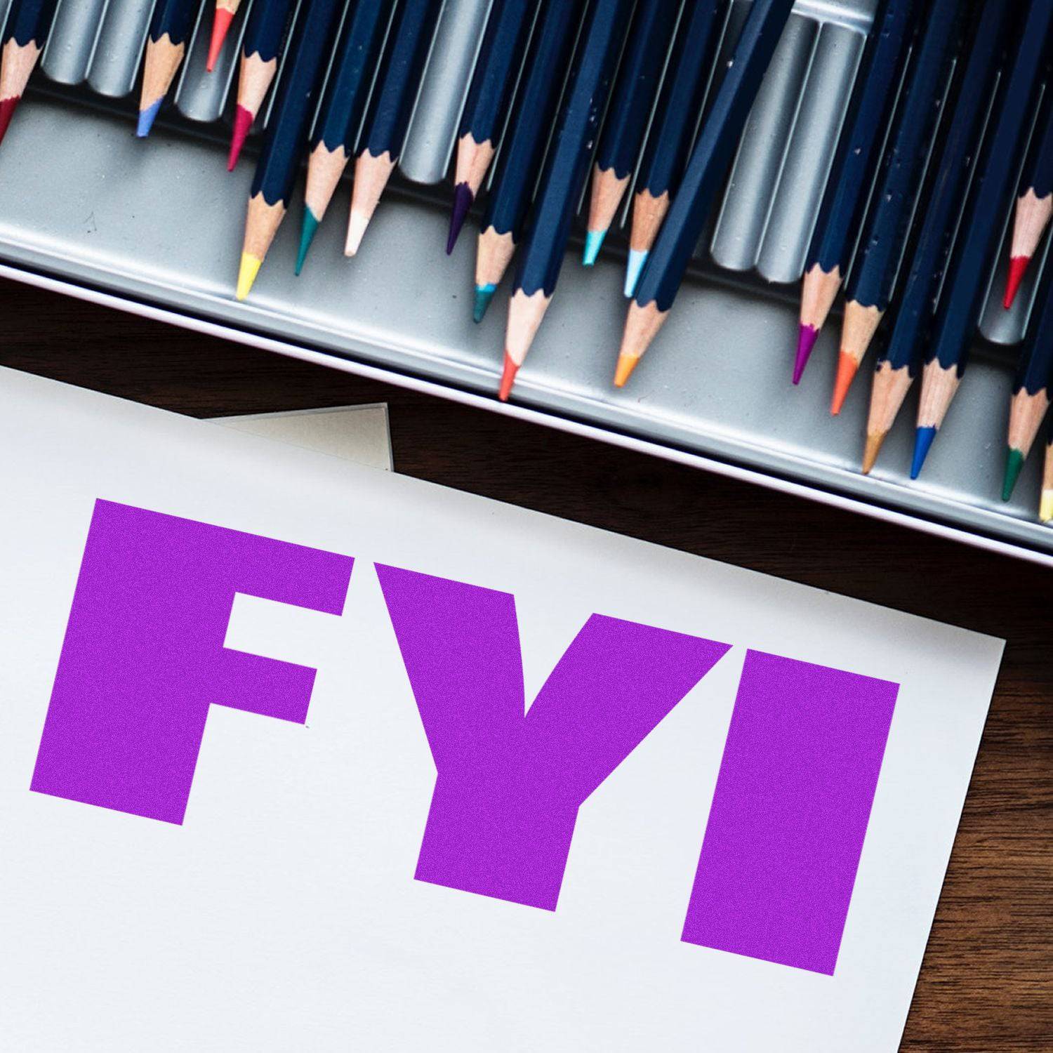 Large Self Inking Bold FYI Stamp in purple ink on white paper, with colored pencils in the background.