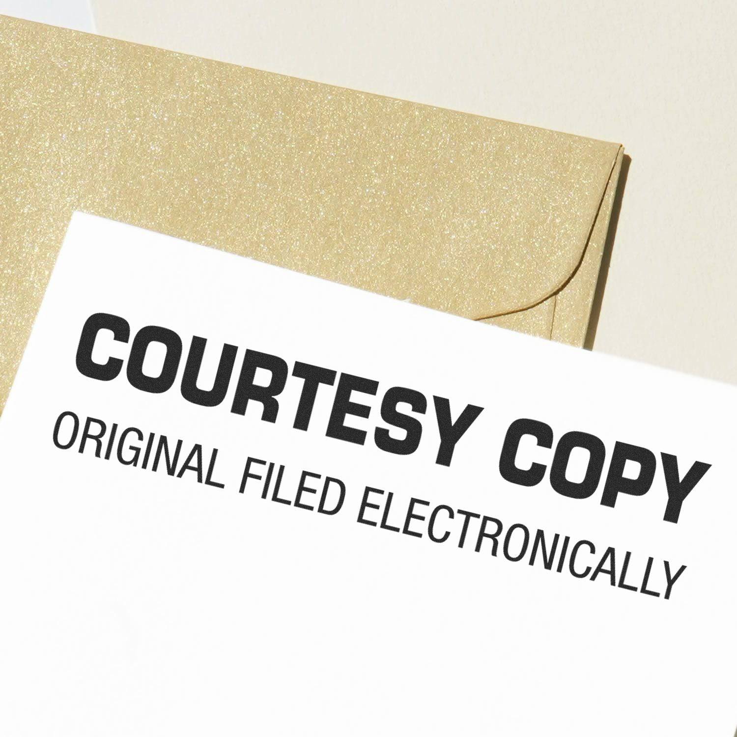 Large Pre-Inked Courtesy Copy Original Filed Electronically Stamp used on a document, with a gold envelope in the background.