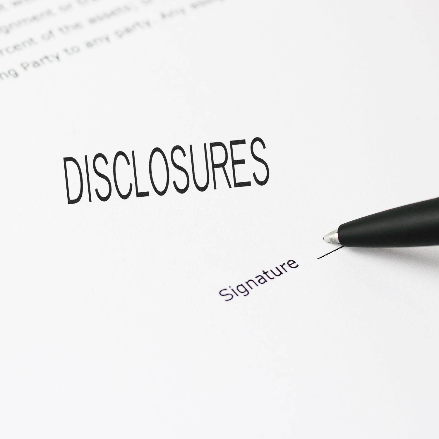 A document stamped with DISCLOSURES using the Large Pre-Inked Disclosures Stamp, with a pen pointing to a signature line.