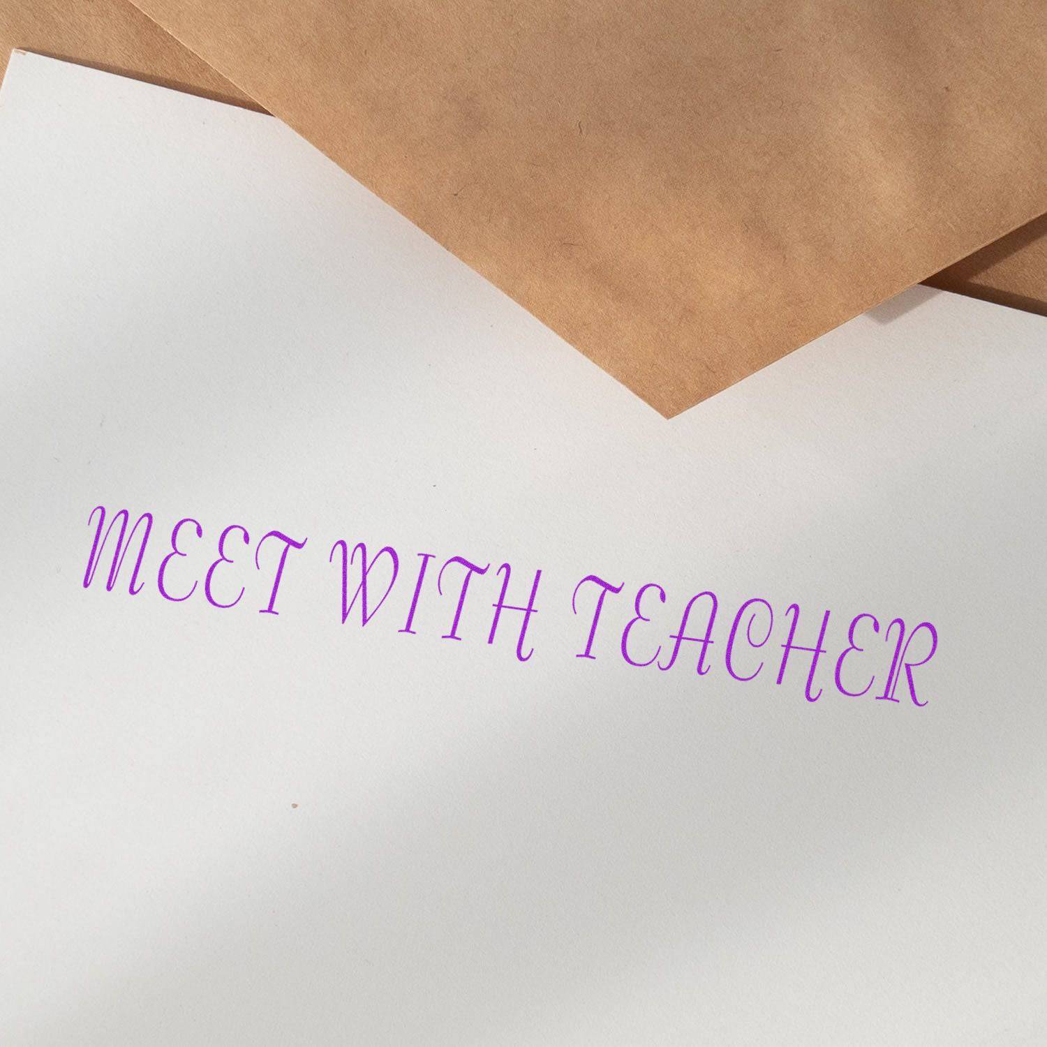 Large Pre-Inked Meet With Teacher Stamp in purple ink on white paper, with brown envelopes in the background.