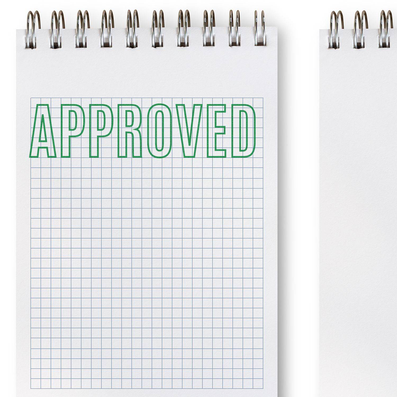 Notebook with grid paper stamped APPROVED in green using the Large Pre-Inked Outline Approved Stamp.