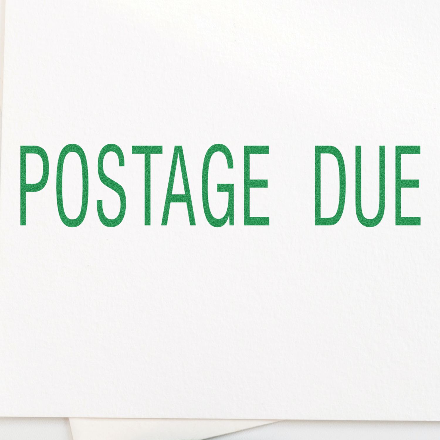 Slim Pre-Inked Postage Due Stamp in green ink on white paper, clearly displaying the words POSTAGE DUE in bold letters.
