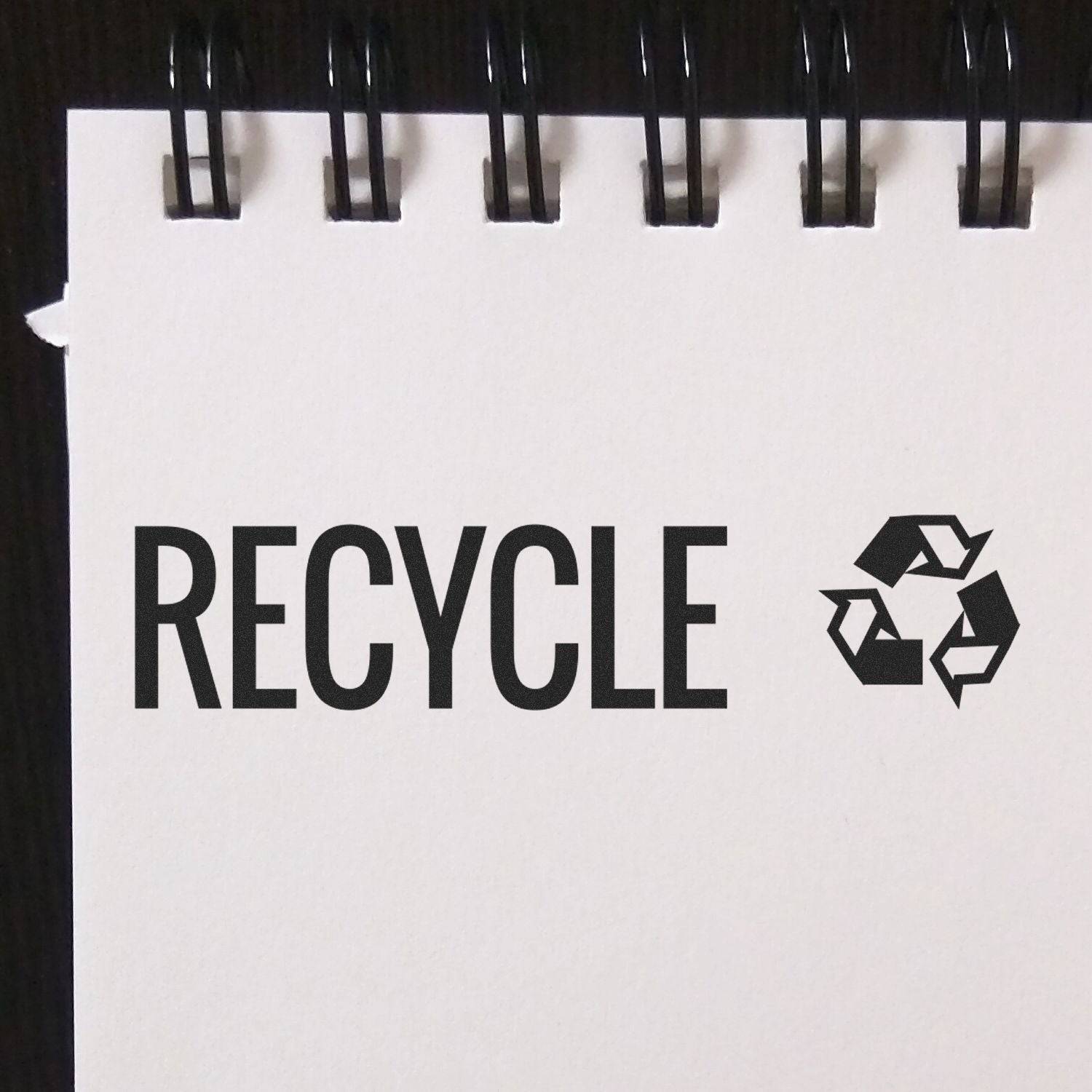 Large Recycle with Logo Rubber Stamp used on white paper, showing the word RECYCLE and a recycling symbol next to it.