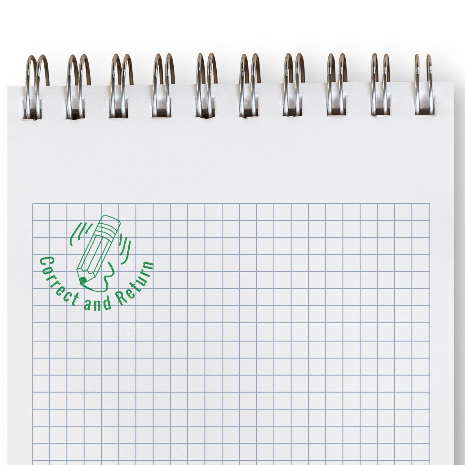 Round Correct and Return rubber stamp in green ink on a spiral-bound graph paper notebook.