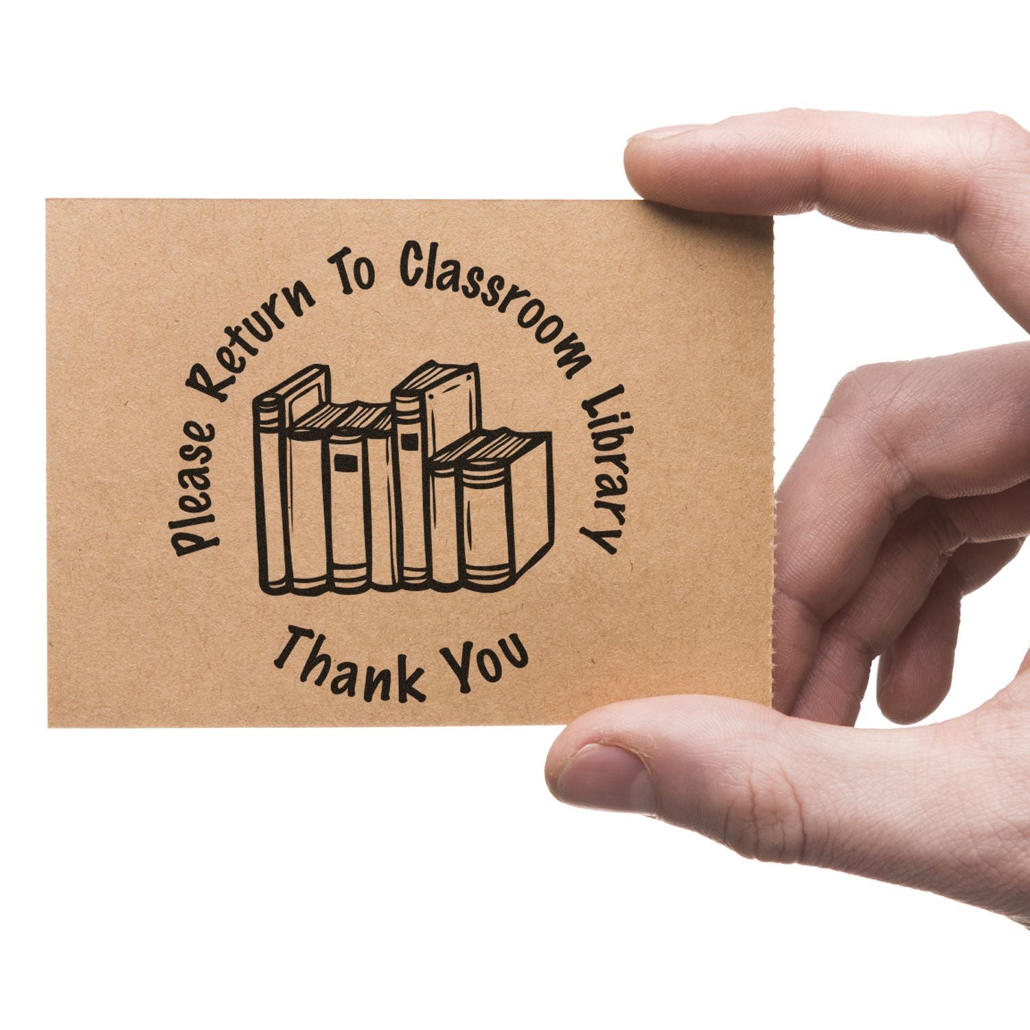 Hand holding a card stamped with Please Return to Classroom Library Thank You using the Self Inking Round Please Return to Classroom Stamp.