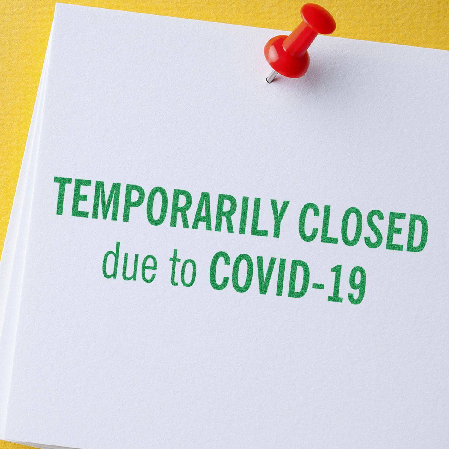 Large Pre-Inked Temporarily Closed Stamp used on a white paper with the text TEMPORARILY CLOSED due to COVID-19 pinned with a red pushpin.