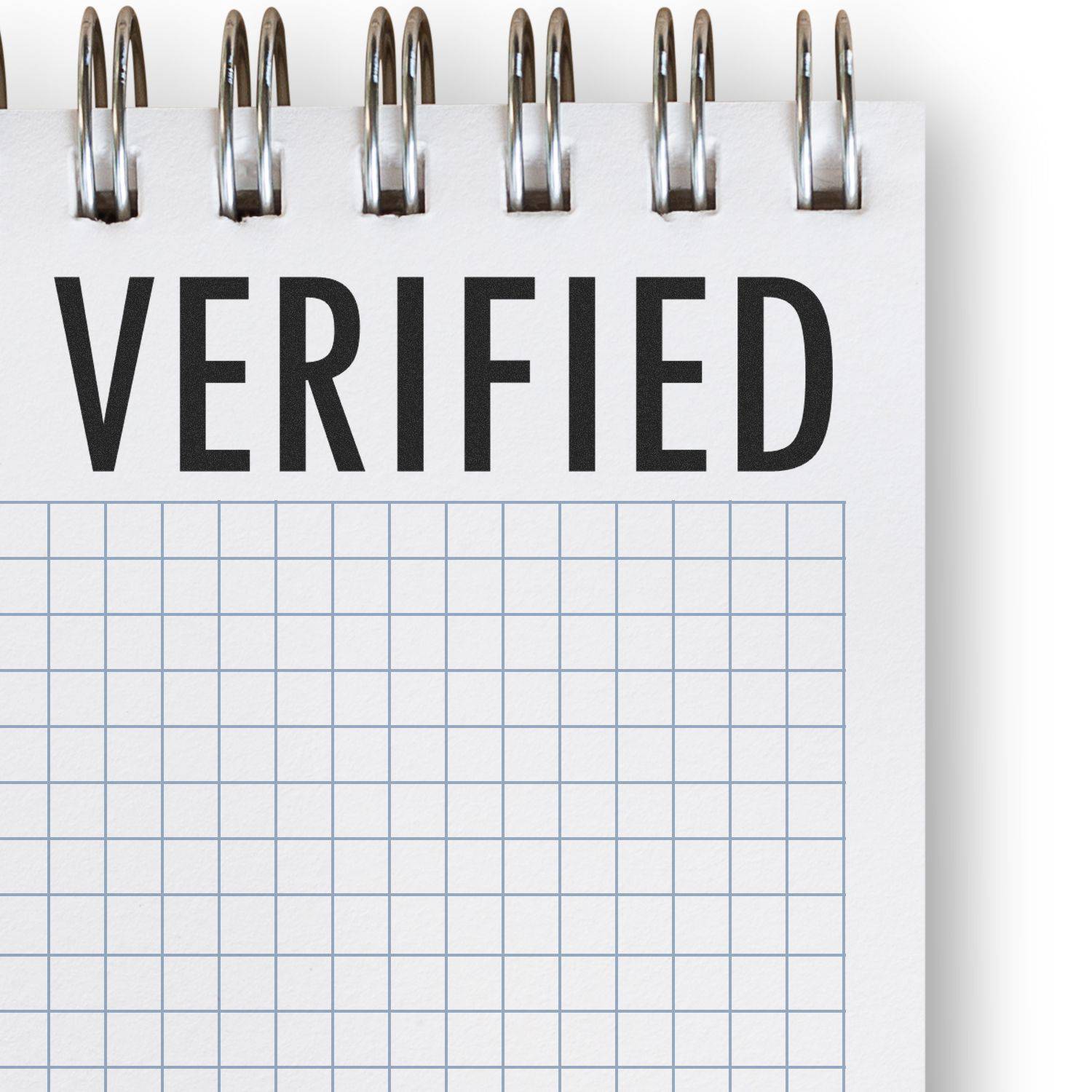 Large Pre-Inked Verified Stamp marking VERIFIED in bold black letters on a white notepad with a grid pattern.