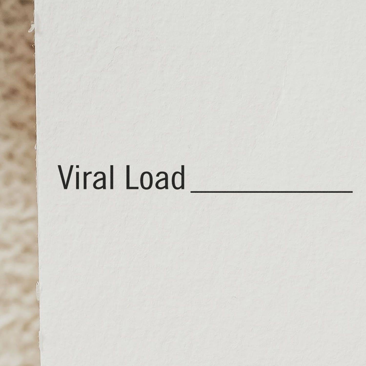Large Pre-Inked Viral Load Stamp in use, displaying Viral Load text with a blank line on a white surface.