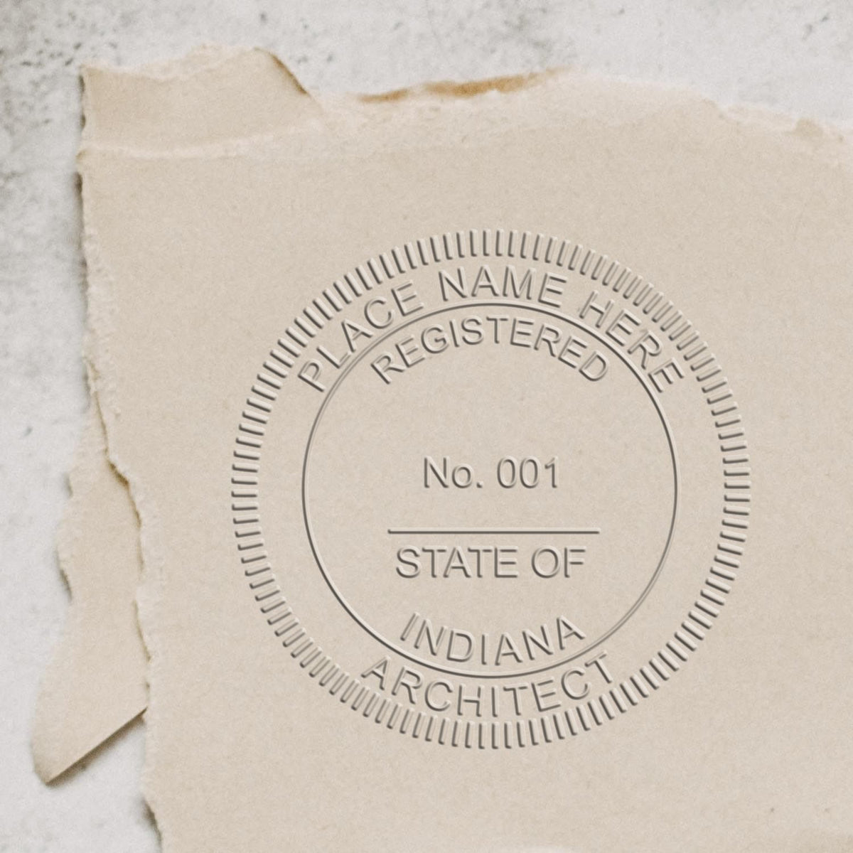 A stamped impression of the Handheld Indiana Architect Seal Embosser in this stylish lifestyle photo, setting the tone for a unique and personalized product.