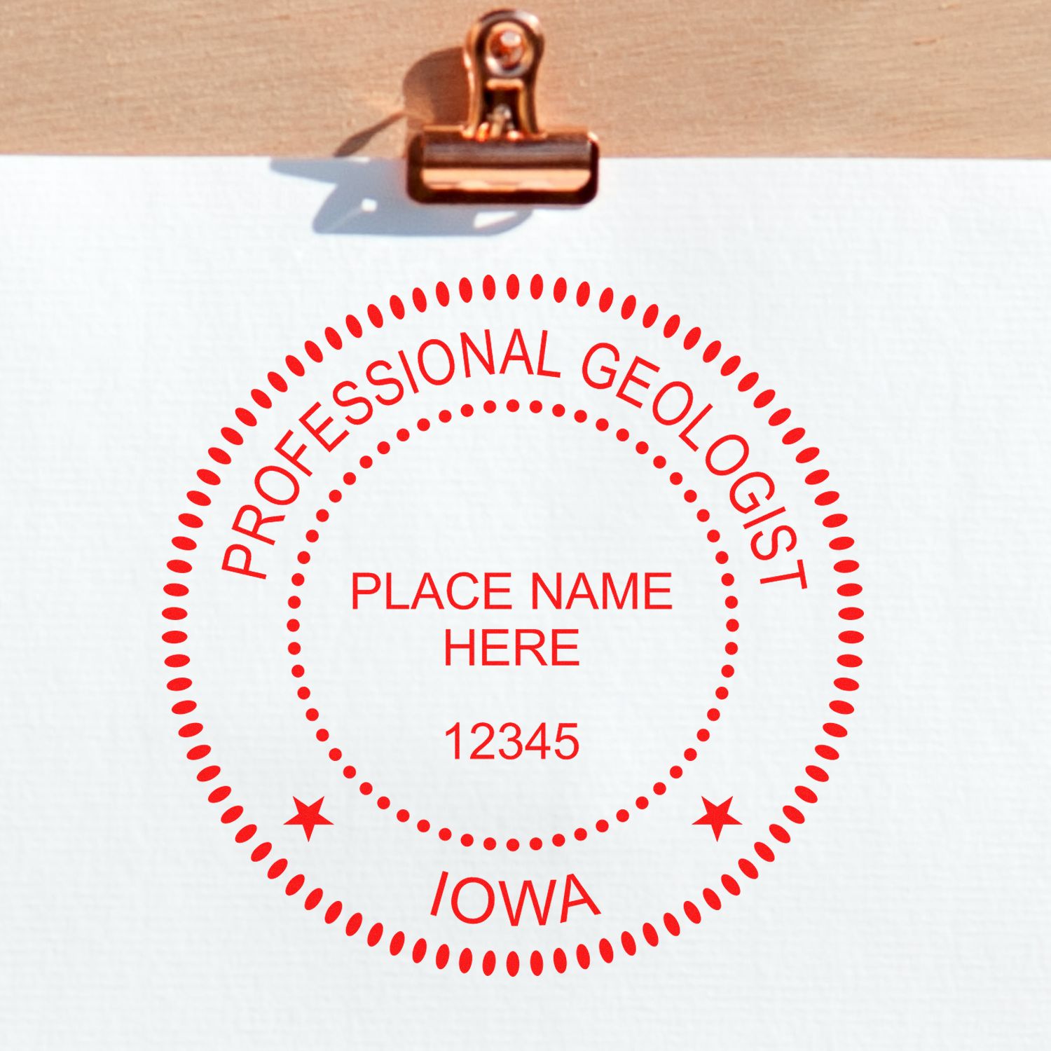 An in use photo of the Slim Pre-Inked Iowa Professional Geologist Seal Stamp showing a sample imprint on a cardstock