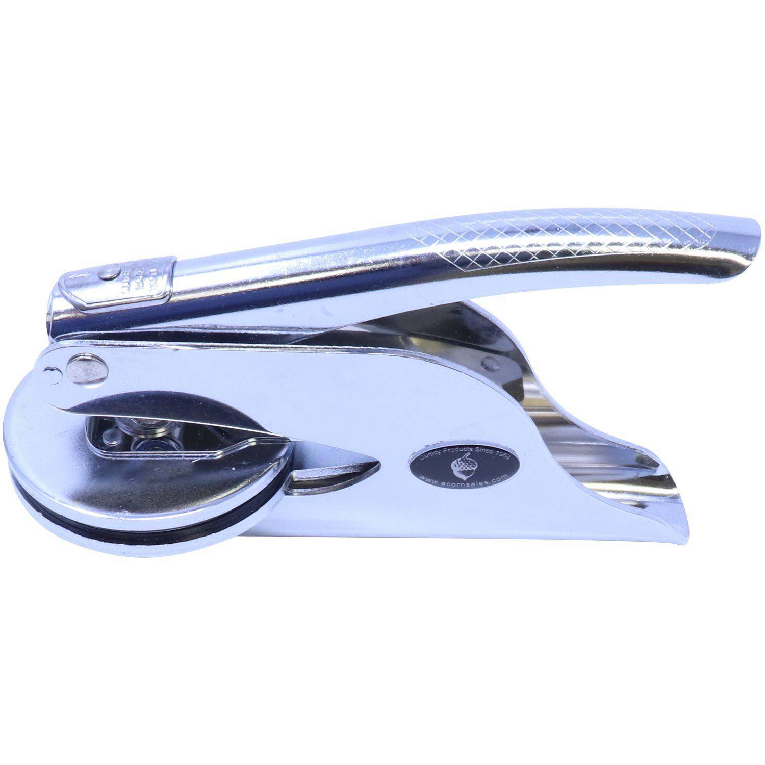 Architect Handheld Seal Embosser in a sleek, metallic finish, shown from an angled side view. The embosser features a textured handle and a circular imprint area, designed for creating professional seals.