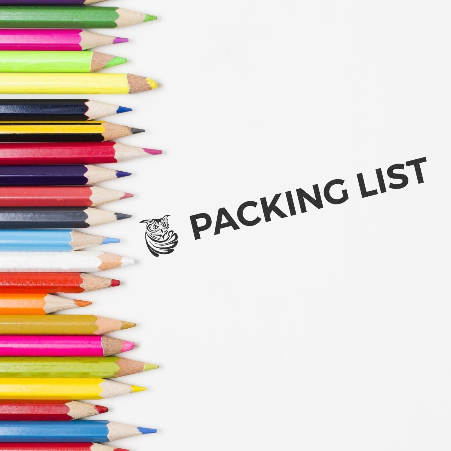 Colorful pencils next to a stamped PACKING LIST using Custom Rubber Stamp Size 1-1/2 x 8 on white paper.