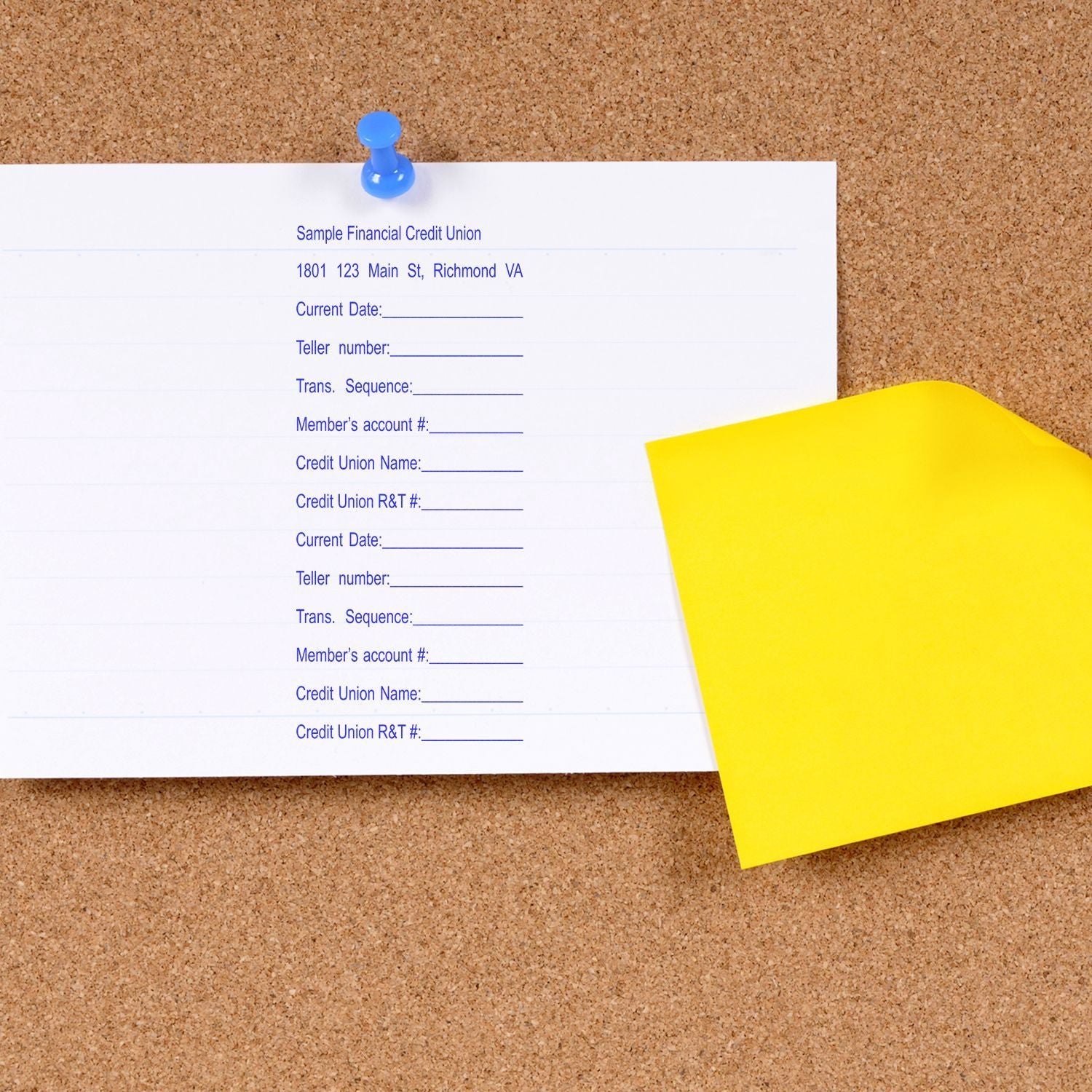 14 Line Custom Rubber Stamp with Wood Handle in use on a white paper pinned to a corkboard, next to a yellow sticky note.