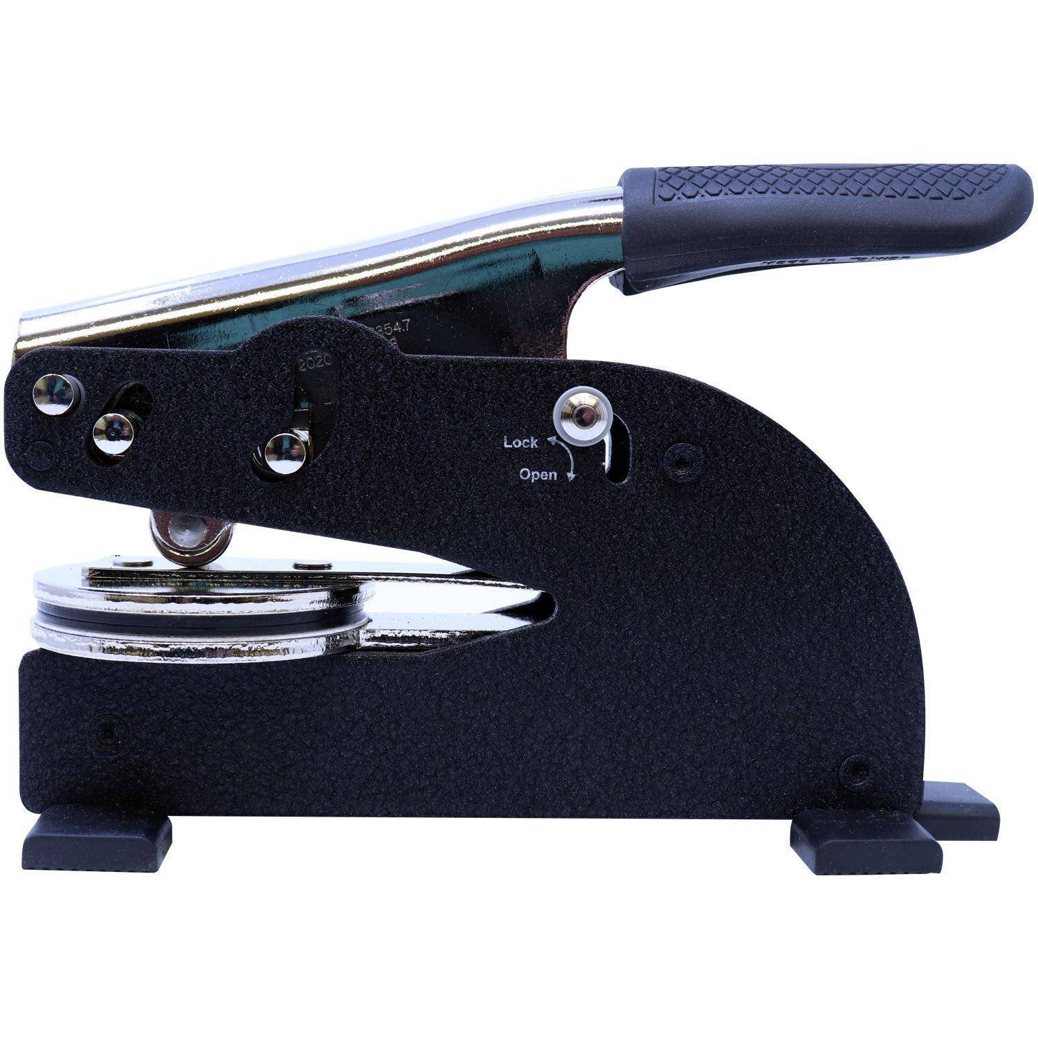 Side view of the Architect Long Reach Desk Seal Embosser, featuring a black and silver design with a textured handle and a lock mechanism. The embosser is positioned on a white background.