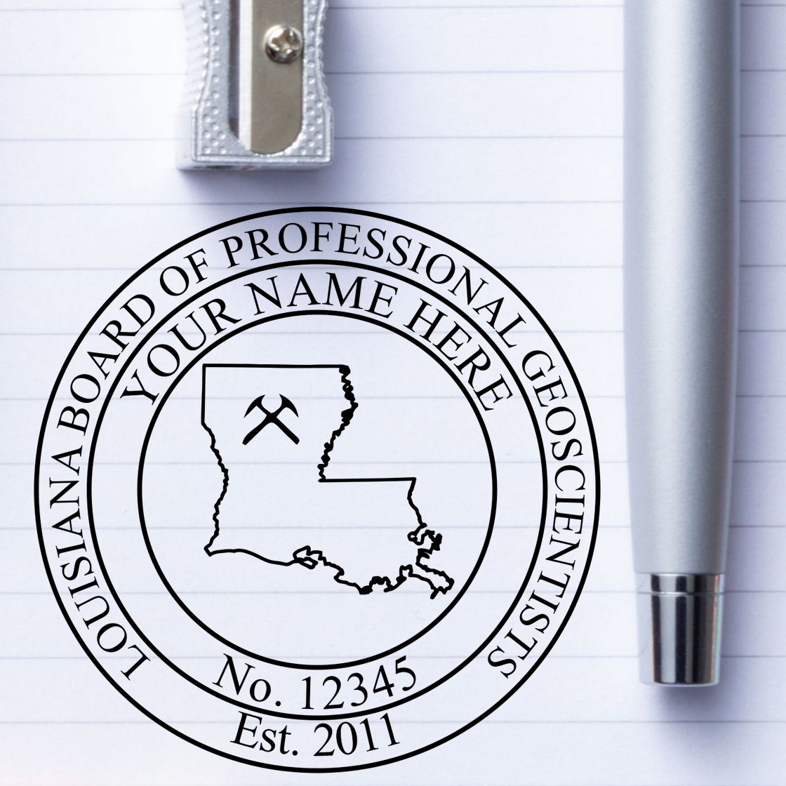 A lifestyle photo showing a stamped image of the Slim Pre-Inked Louisiana Professional Geologist Seal Stamp on a piece of paper