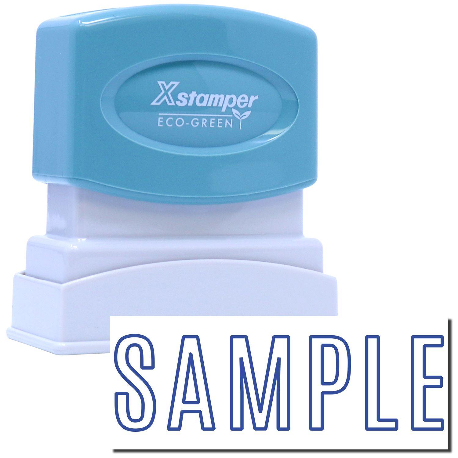 Image of a blue and white Sample Xstamper Stamp with the word SAMPLE stamped in blue ink below it.