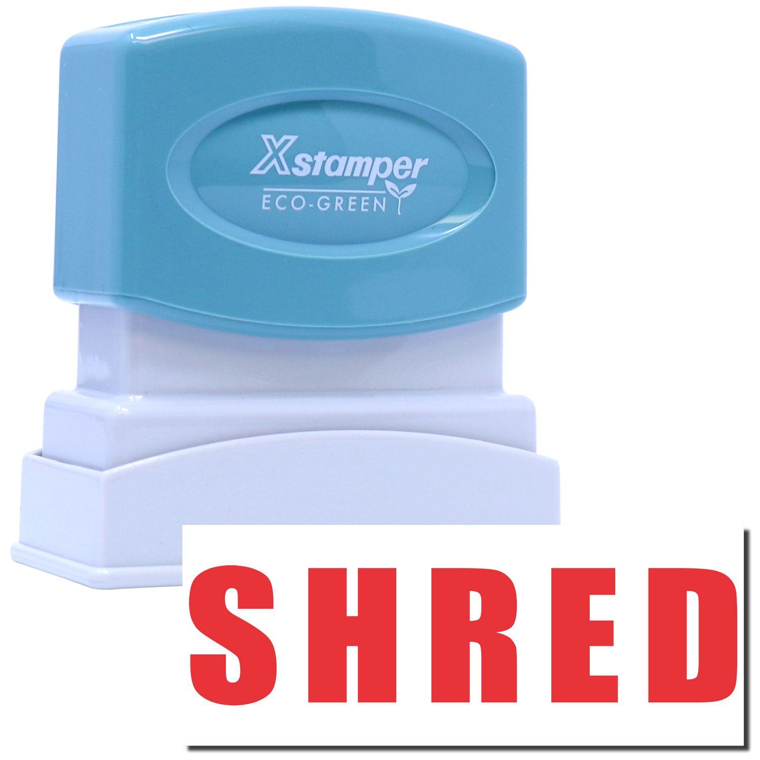 Shred Xstamper Stamp with a blue top and white base, featuring the word SHRED in bold red letters. Eco-friendly design.