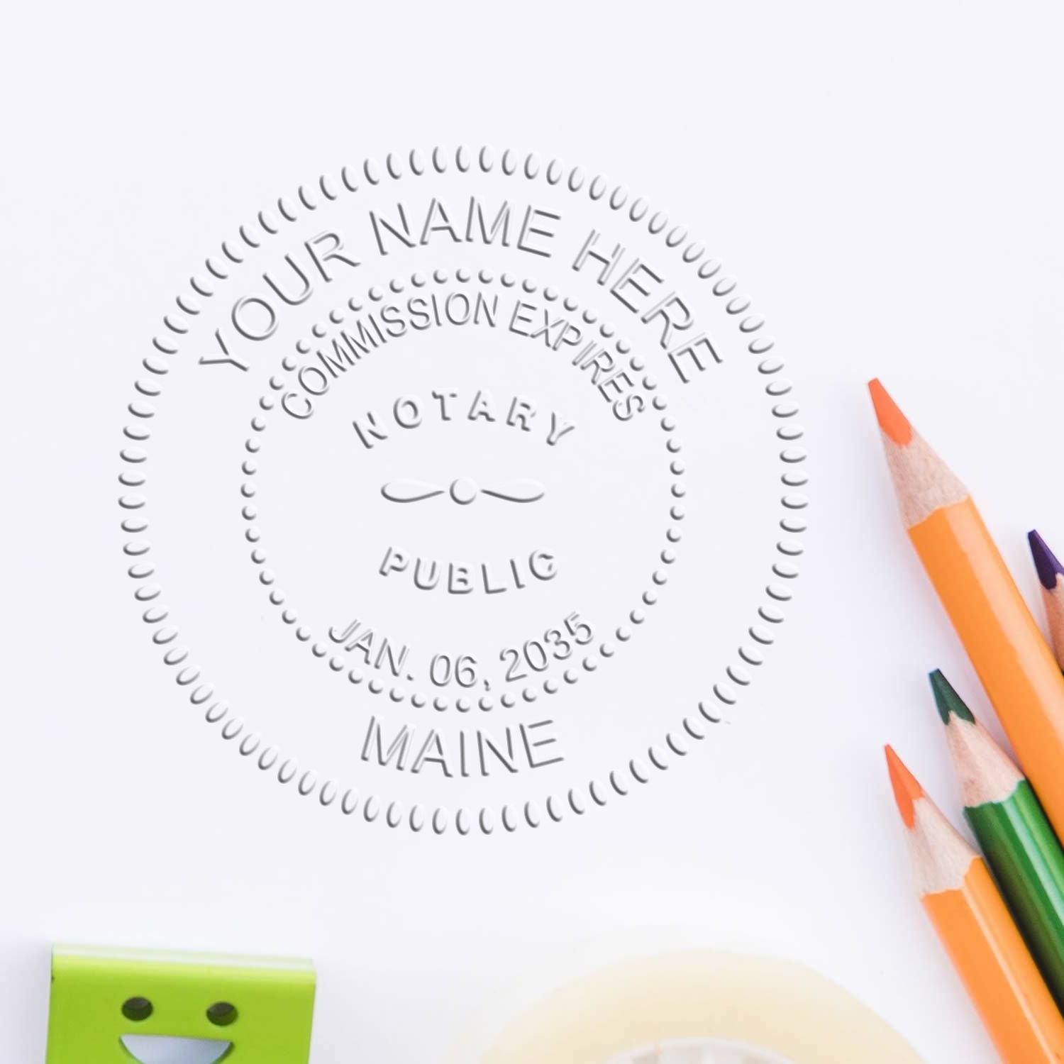 The Maine Handheld Notary Seal Embosser stamp impression comes to life with a crisp, detailed photo on paper - showcasing true professional quality.