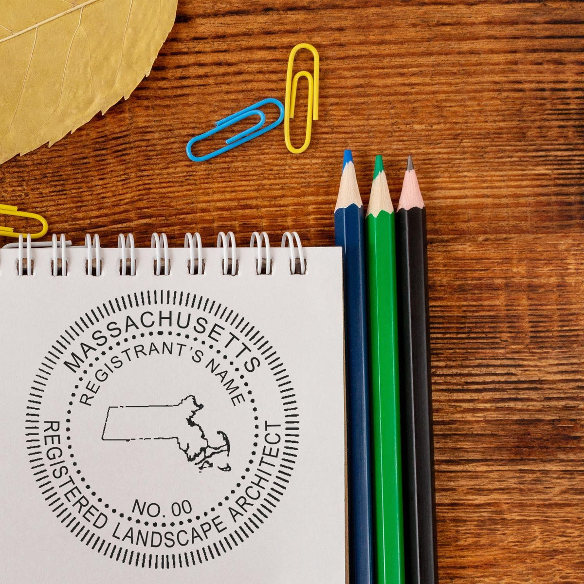 This paper is stamped with a sample imprint of the Slim Pre-Inked Massachusetts Landscape Architect Seal Stamp, signifying its quality and reliability.