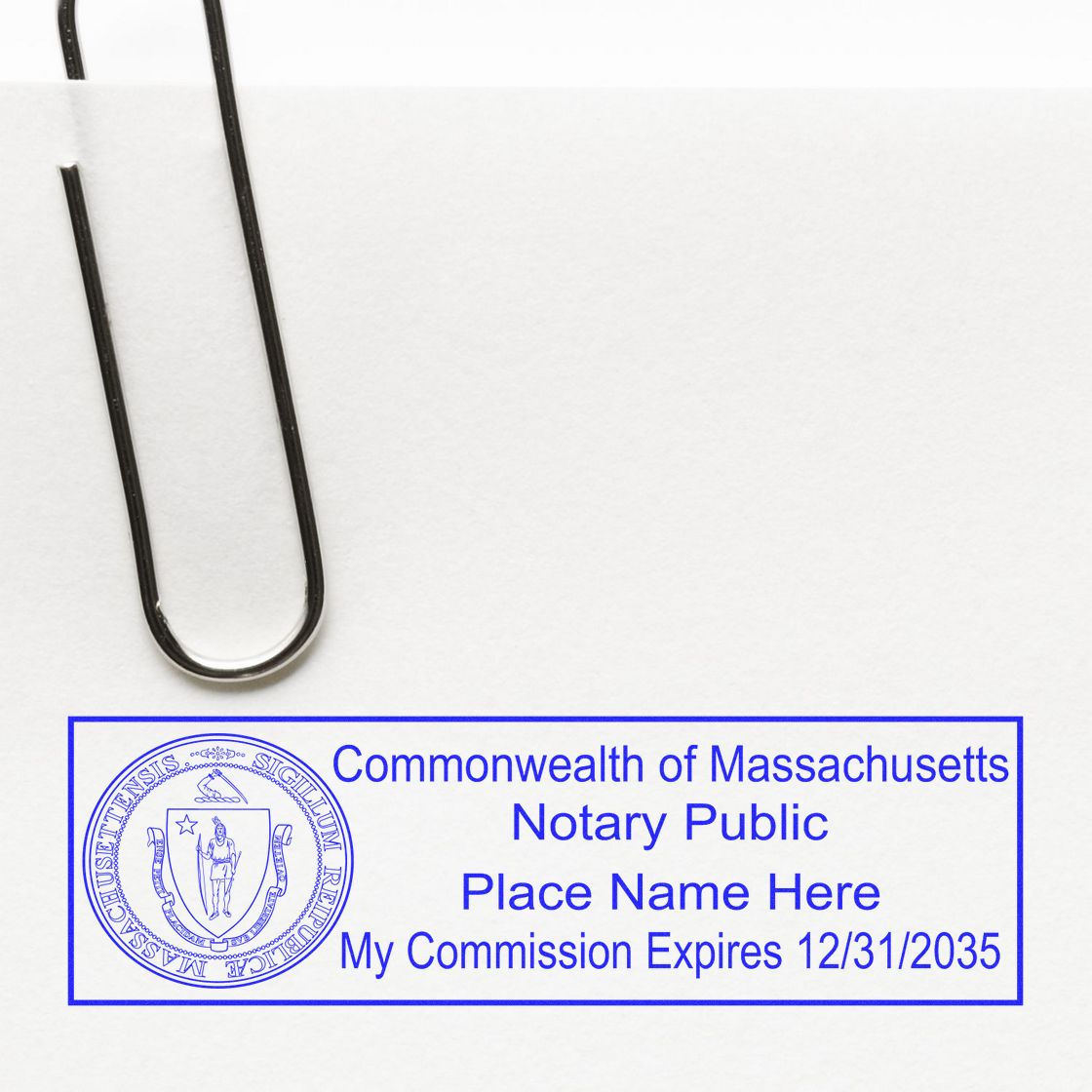 An alternative view of the Heavy-Duty Massachusetts Rectangular Notary Stamp stamped on a sheet of paper showing the image in use