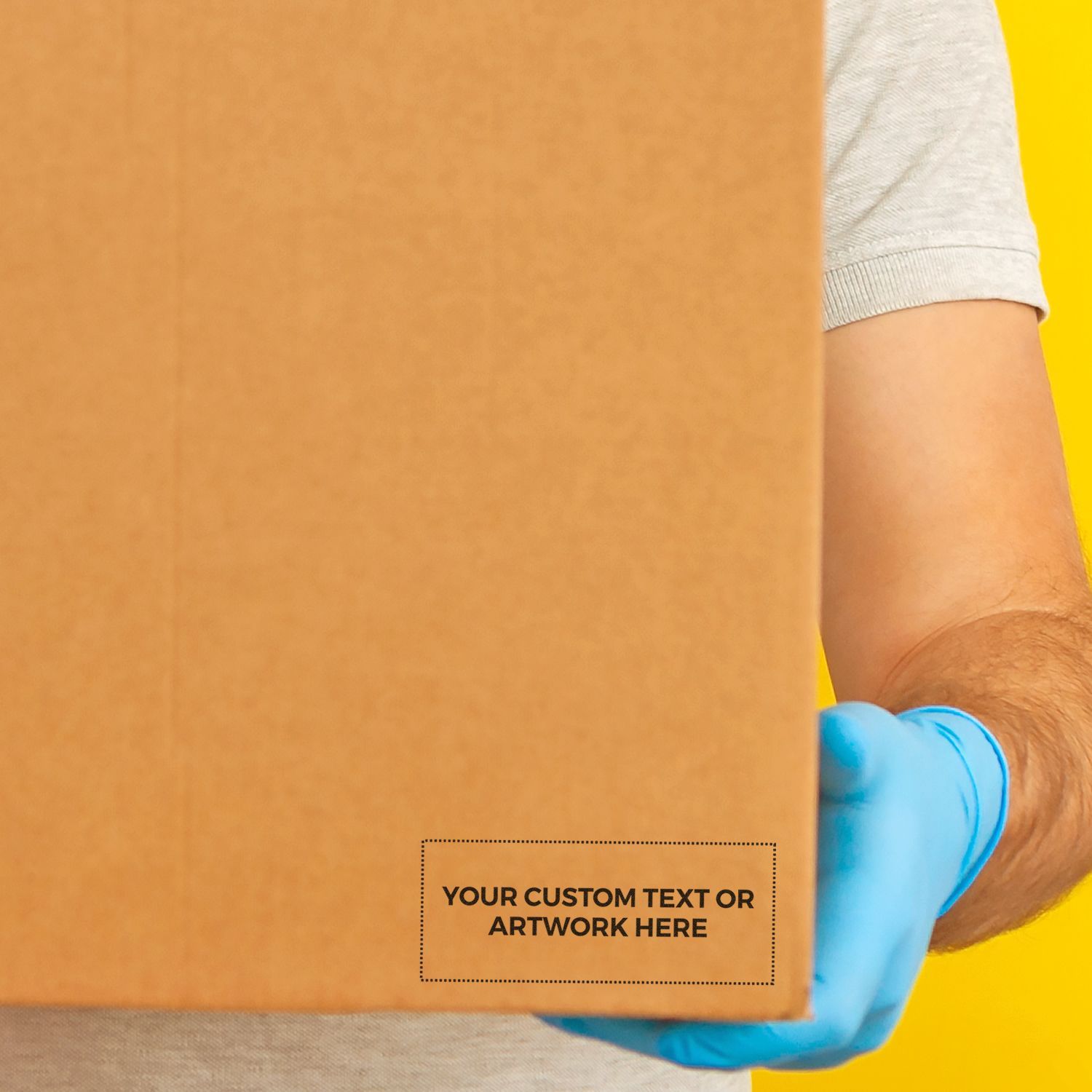 Person holding a cardboard box with a MaxLight XL2-245 Custom Pre-Inked Business Stamp 1-1/4 x 3-3/16 imprint area for custom text or artwork.