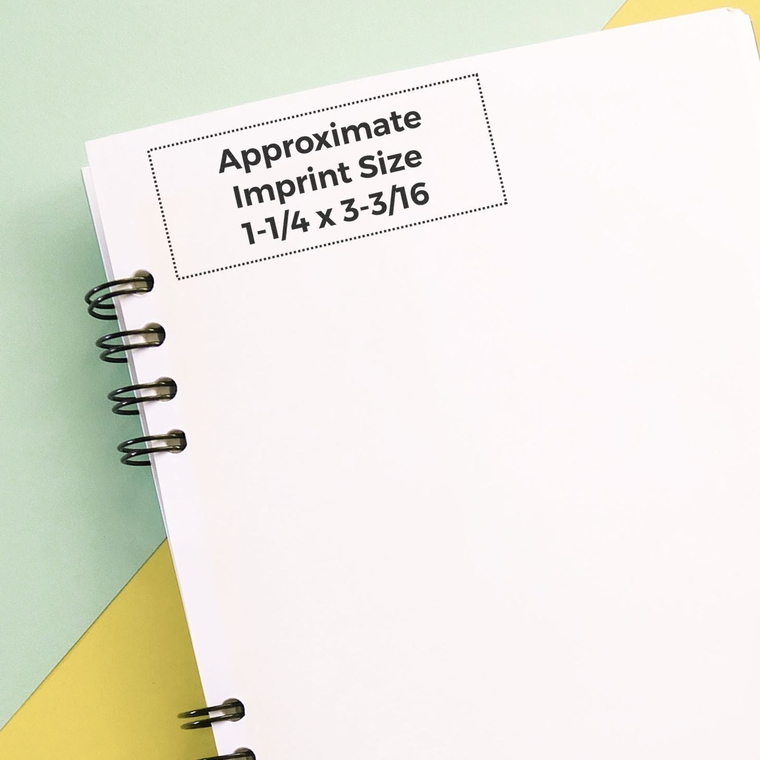 MaxLight XL2-245 Custom Pre-Inked Business Stamp 1-1/4 x 3-3/16 shown on a white notebook with approximate imprint size displayed.