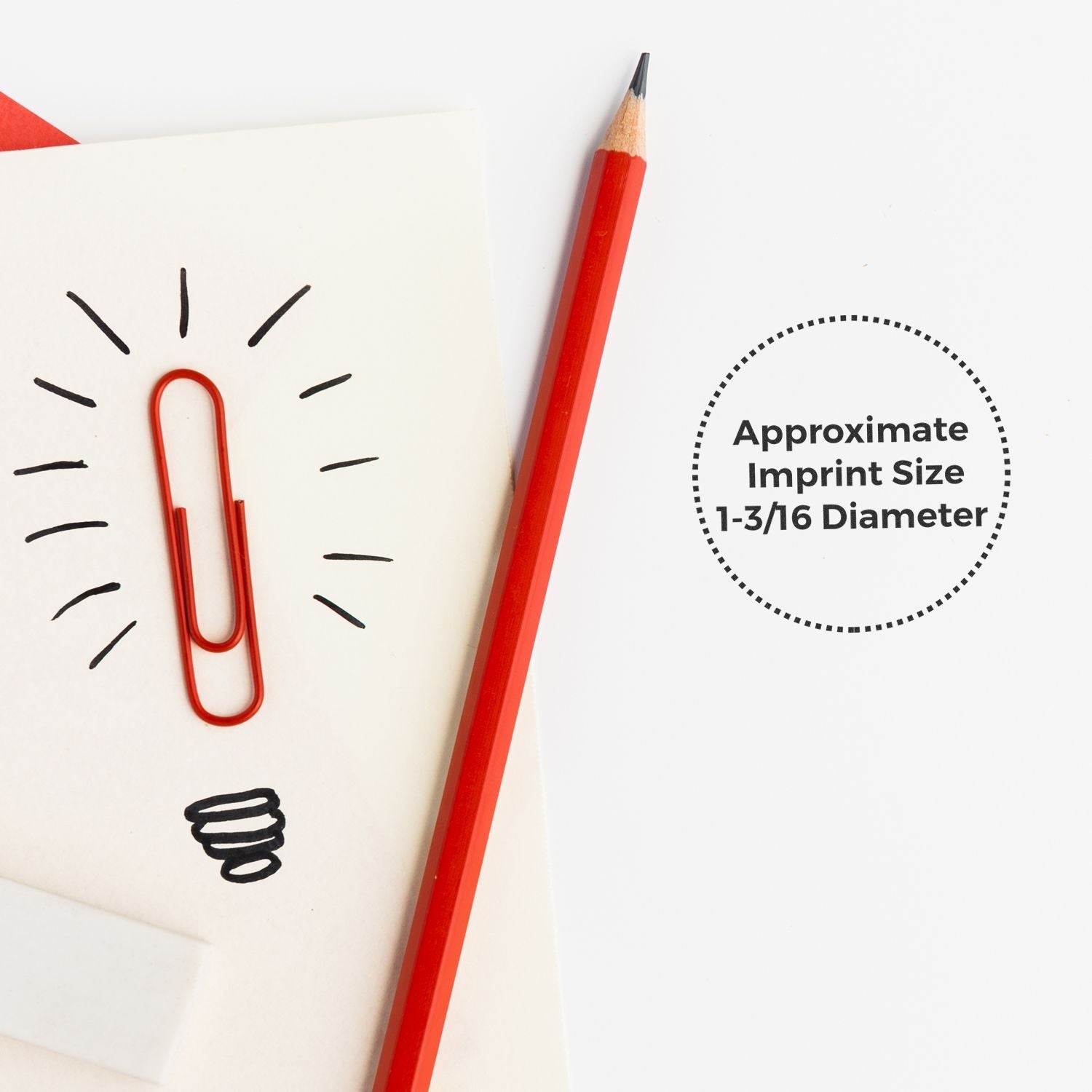Red pencil and paperclip on paper with lightbulb doodle, showing approximate imprint size for MaxLight XL2-495 Custom Pre-Inked Business Stamp 1-3/16 Diameter.