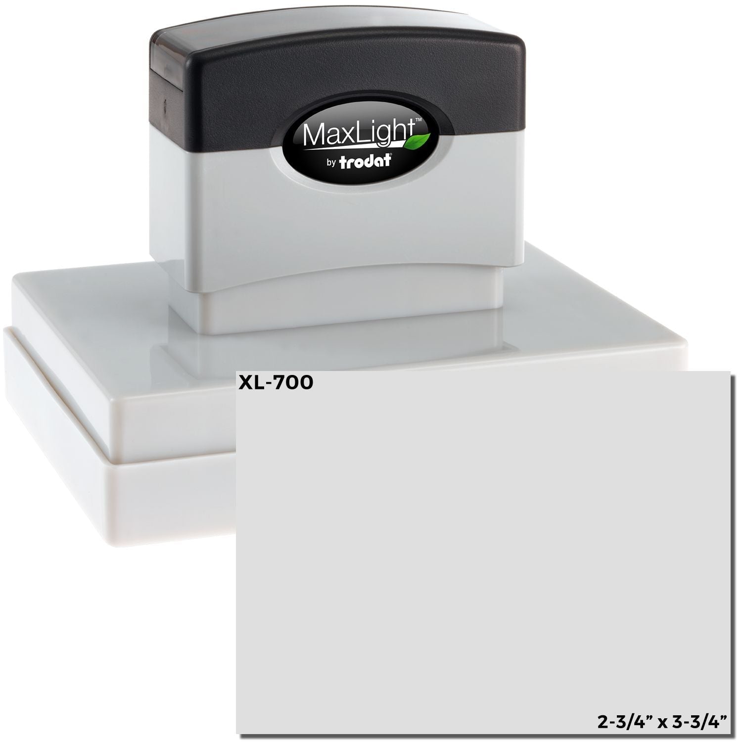 MaxLight XL2-700 Custom Pre-Inked Business Stamp 2-3/4-x 3-3/4, shown with a black top and gray body, placed on a white surface.