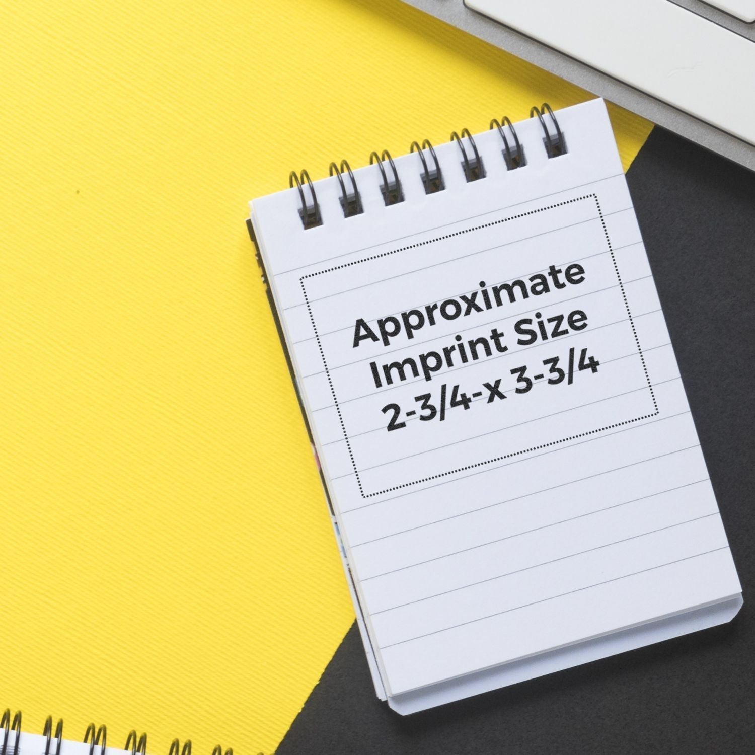 MaxLight XL2-700 Custom Pre-Inked Business Stamp 2-3/4-x 3-3/4 displayed on a yellow and black background with a notepad showing imprint size.