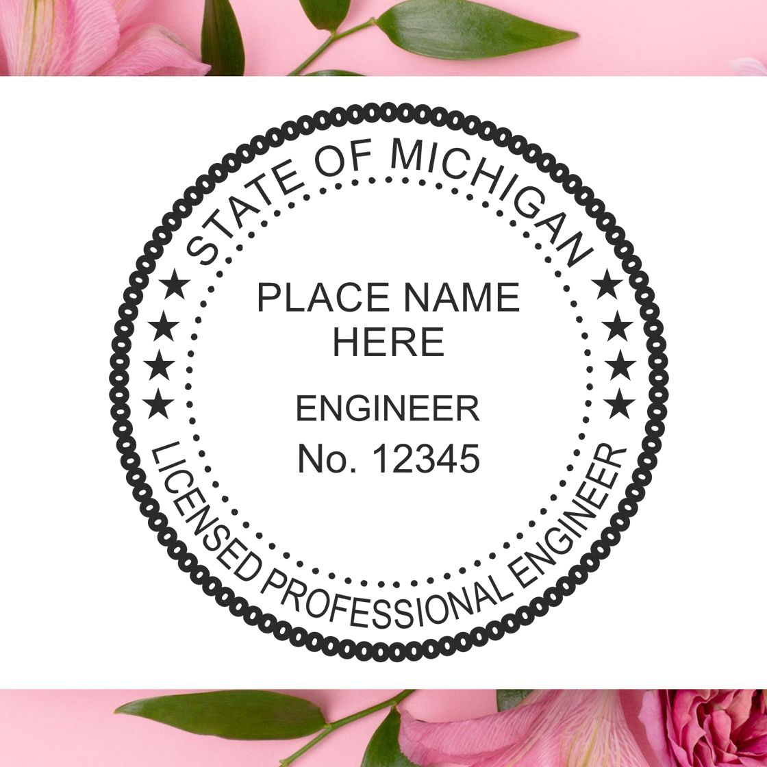 A lifestyle photo showing a stamped image of the Slim Pre-Inked Michigan Professional Engineer Seal Stamp on a piece of paper