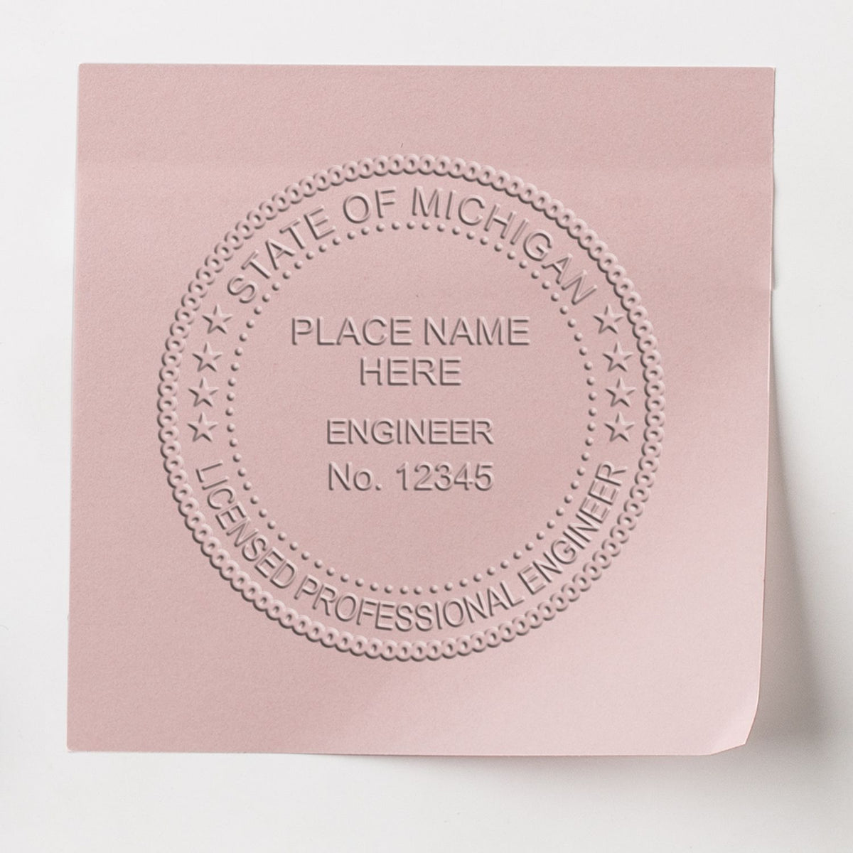 A photograph of the Heavy Duty Cast Iron Michigan Engineer Seal Embosser stamp impression reveals a vivid, professional image of the on paper.