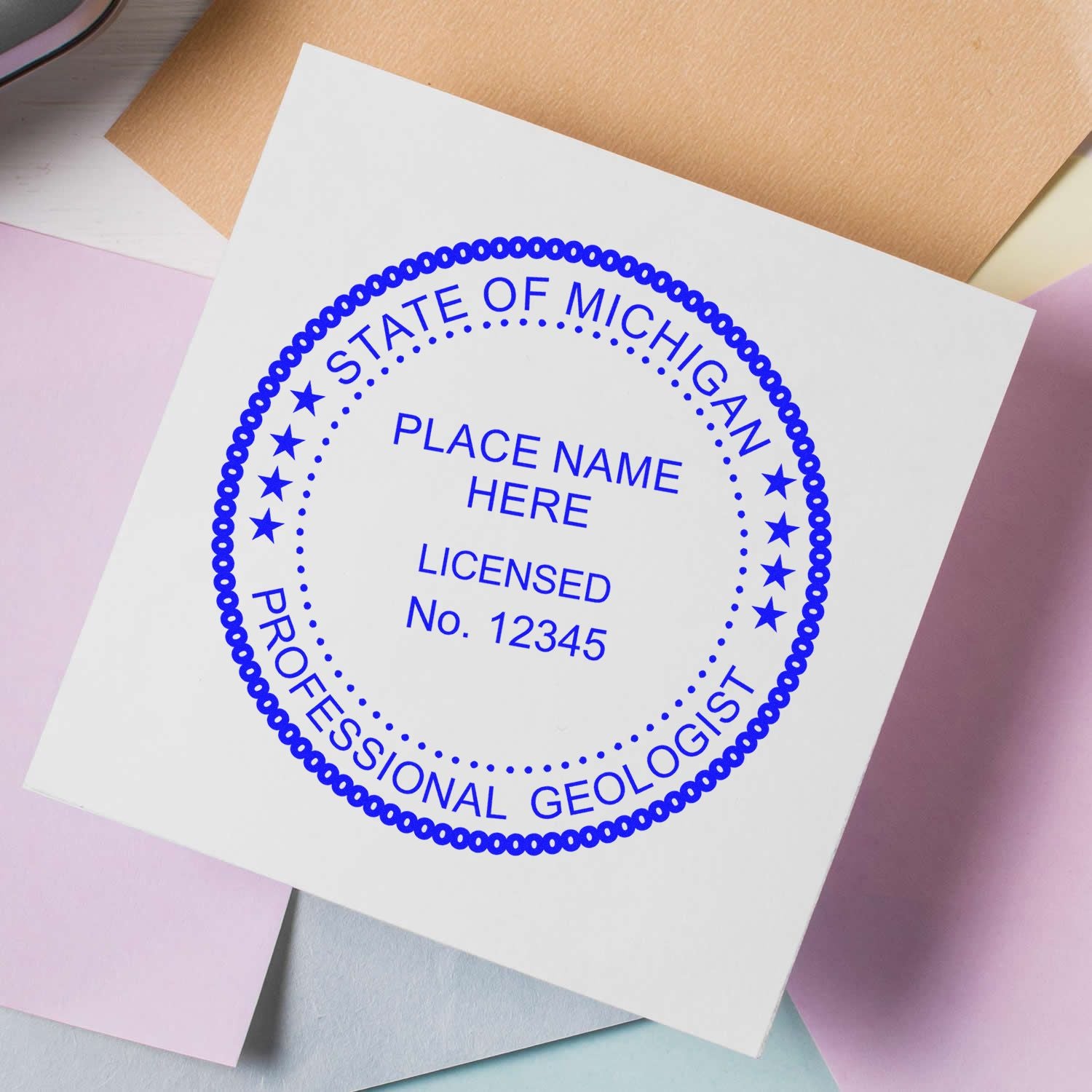An alternative view of the Slim Pre-Inked Michigan Professional Geologist Seal Stamp stamped on a sheet of paper showing the image in use