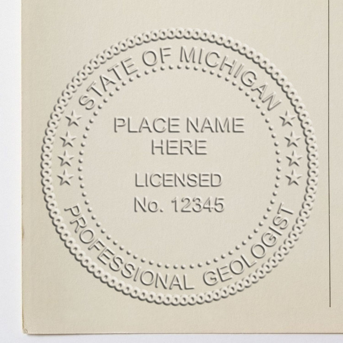 A lifestyle photo showing a stamped image of the Handheld Michigan Professional Geologist Embosser on a piece of paper