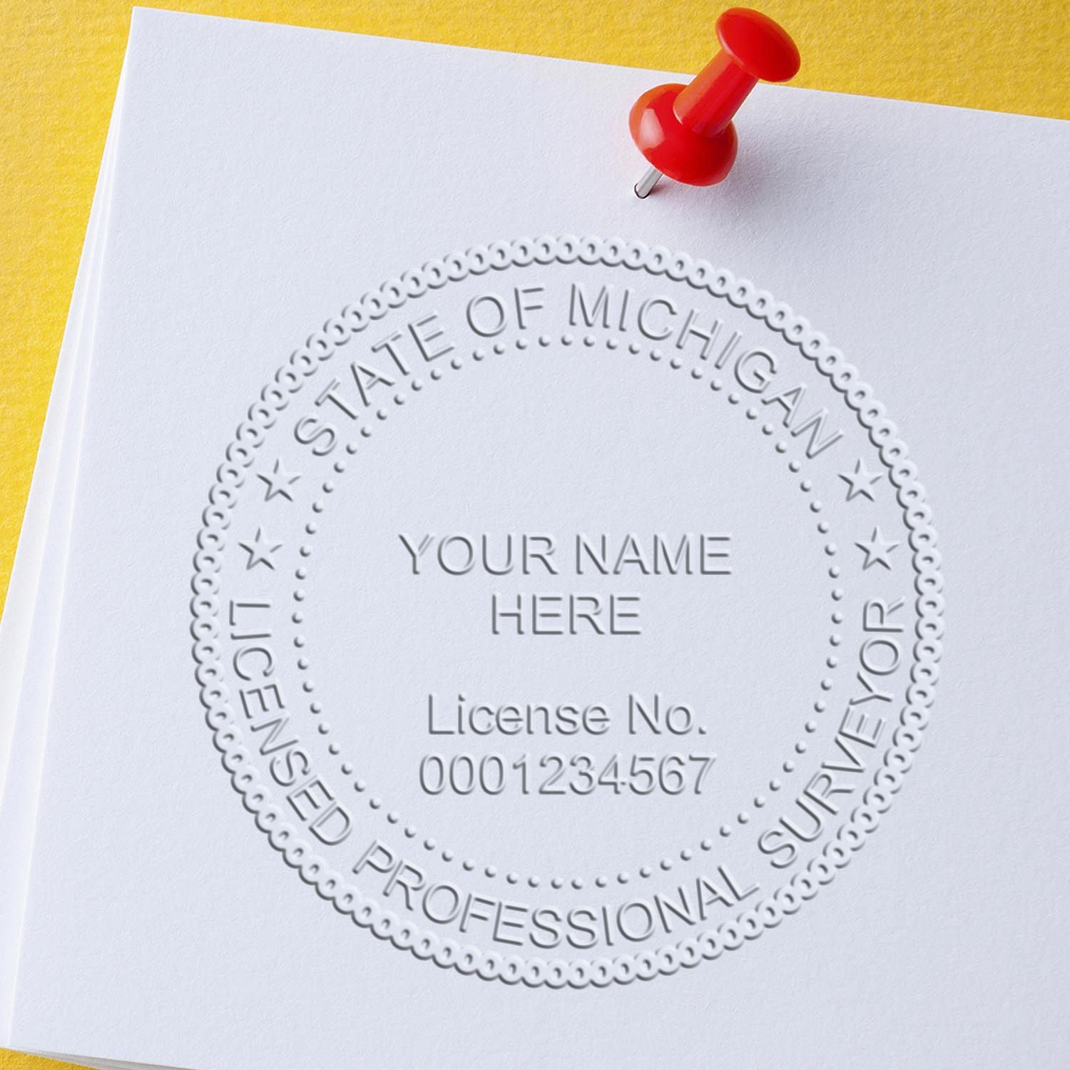 A lifestyle photo showing a stamped image of the Michigan Desk Surveyor Seal Embosser on a piece of paper
