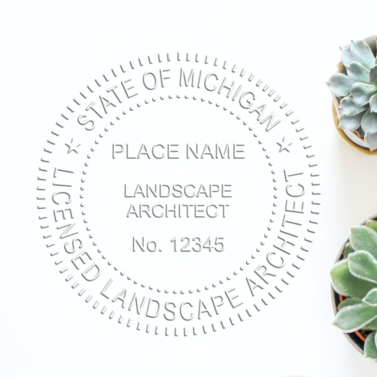An in use photo of the Hybrid Michigan Landscape Architect Seal showing a sample imprint on a cardstock