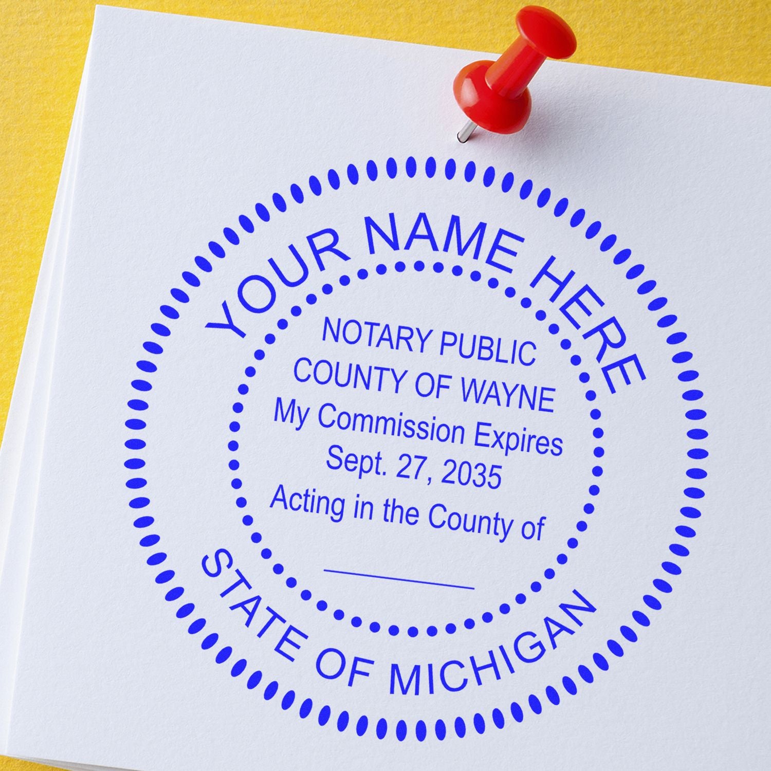 An alternative view of the Heavy-Duty Round Michigan Notary Stamp stamped on a sheet of paper showing the image in use