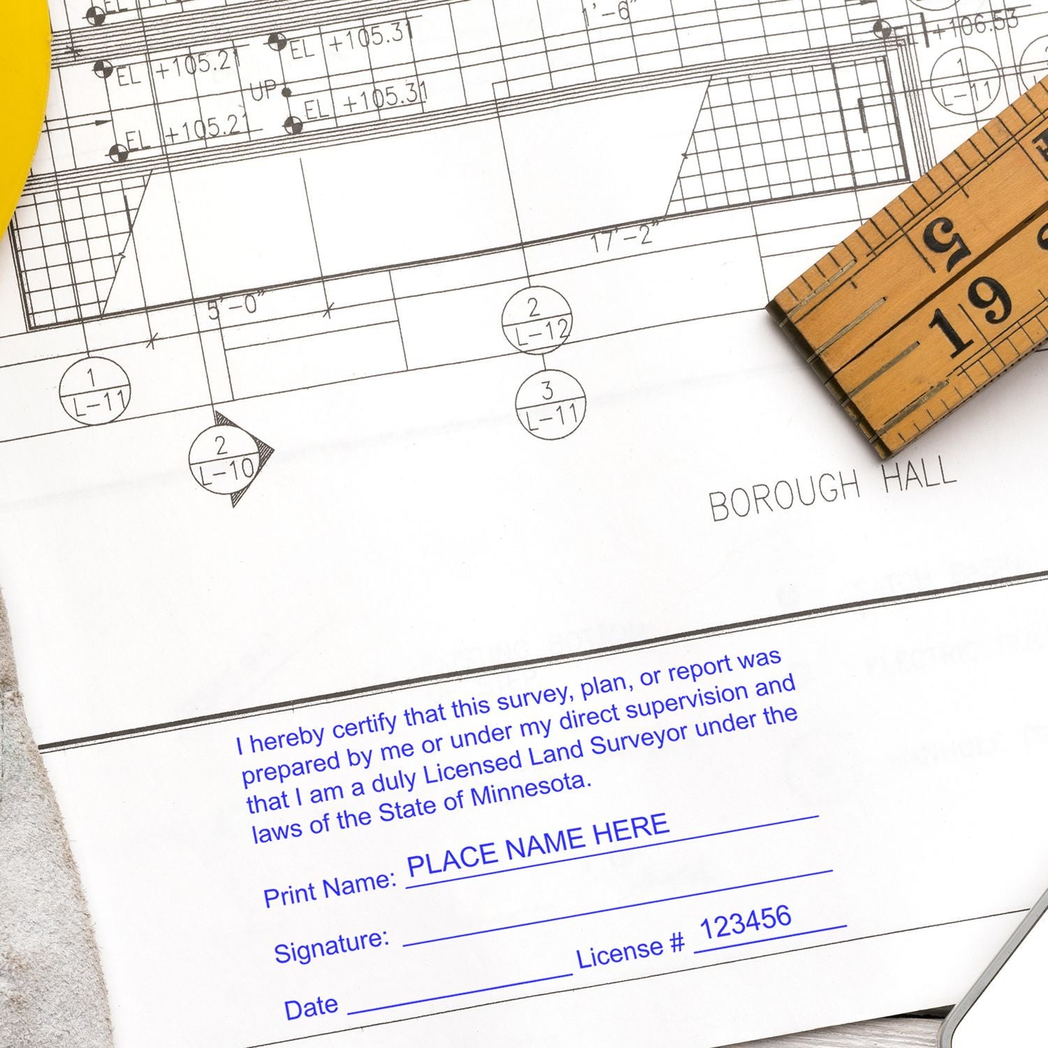 Land Surveyor Regular Rubber Stamp of Seal used on a document with a ruler and architectural plans in the background.