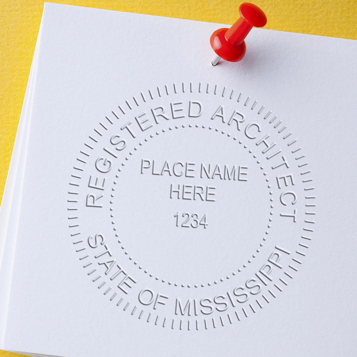 A lifestyle photo showing a stamped image of the Mississippi Desk Architect Embossing Seal on a piece of paper