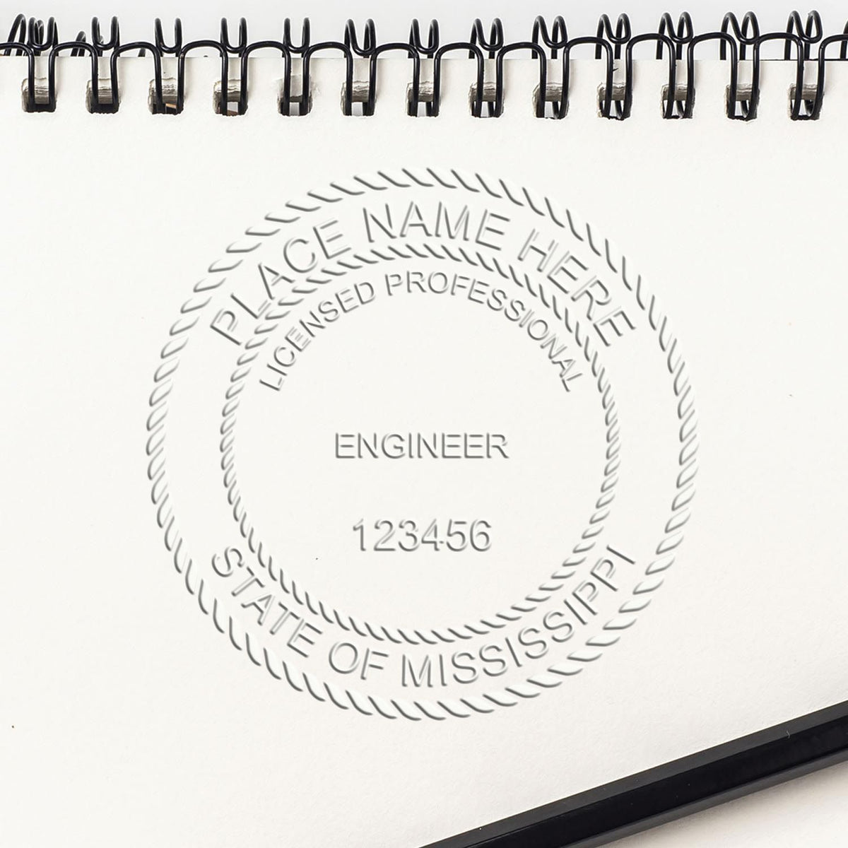 A stamped impression of the Soft Mississippi Professional Engineer Seal in this stylish lifestyle photo, setting the tone for a unique and personalized product.