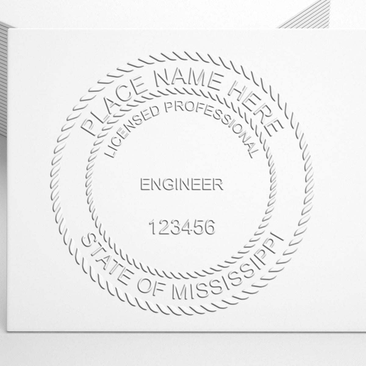 An alternative view of the State of Mississippi Extended Long Reach Engineer Seal stamped on a sheet of paper showing the image in use