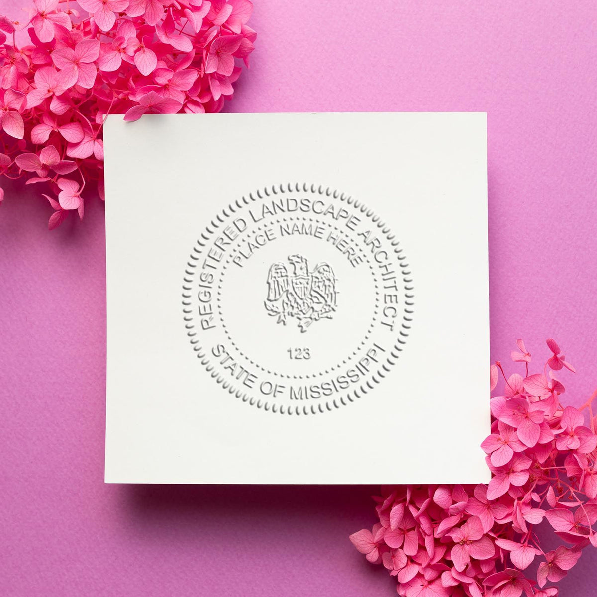 An in use photo of the Gift Mississippi Landscape Architect Seal showing a sample imprint on a cardstock
