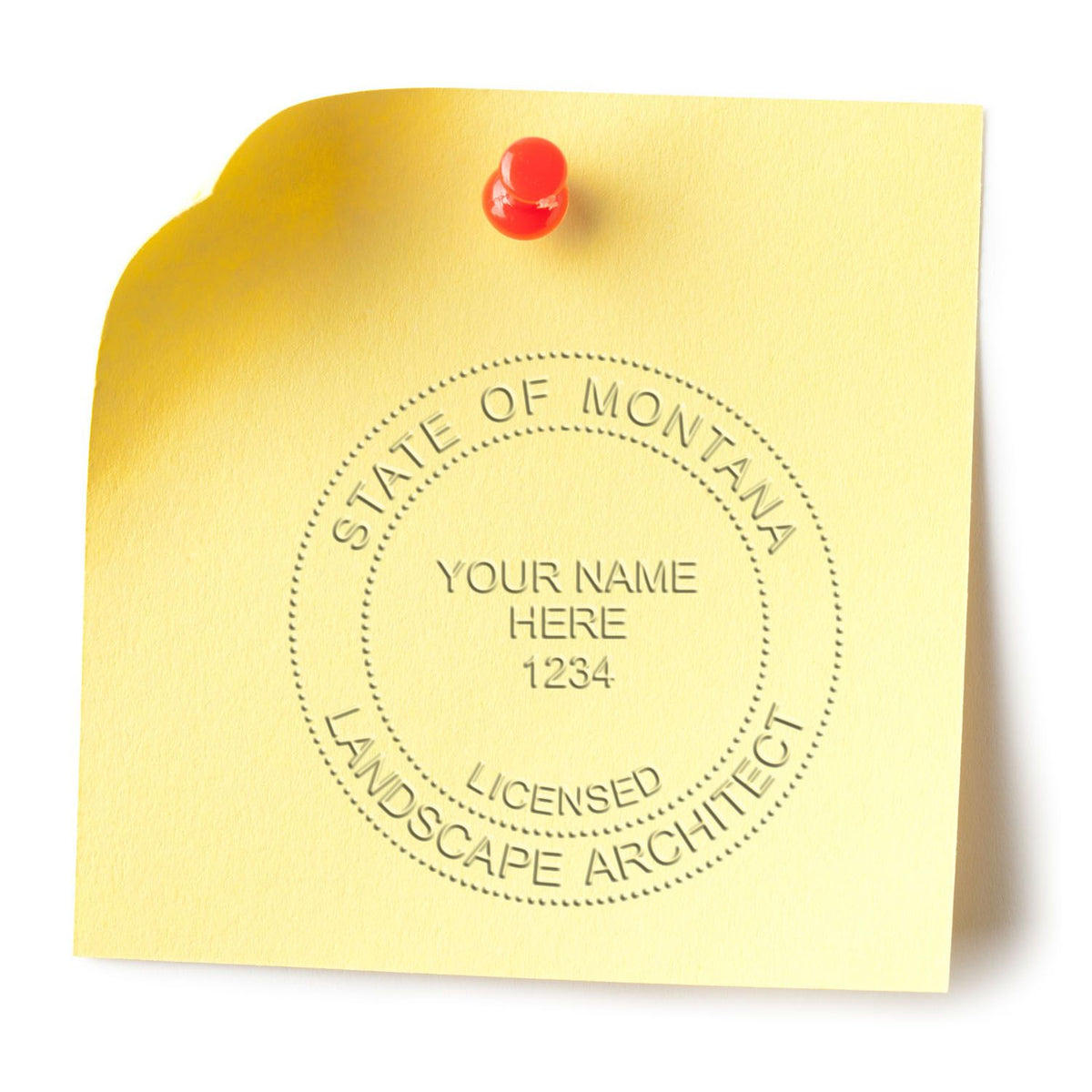 A lifestyle photo showing a stamped image of the Soft Pocket Montana Landscape Architect Embosser on a piece of paper