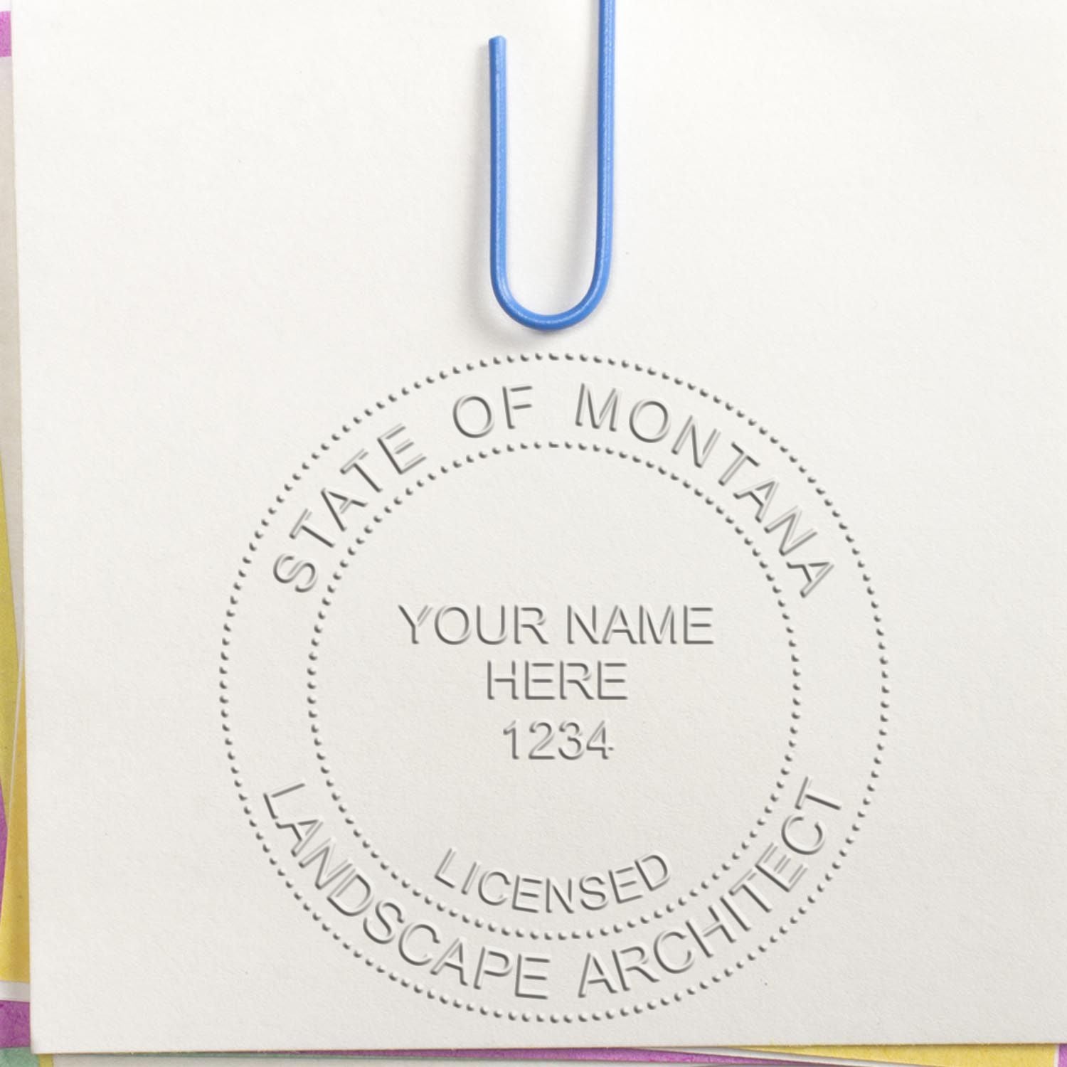 A stamped impression of the State of Montana Handheld Landscape Architect Seal in this stylish lifestyle photo, setting the tone for a unique and personalized product.