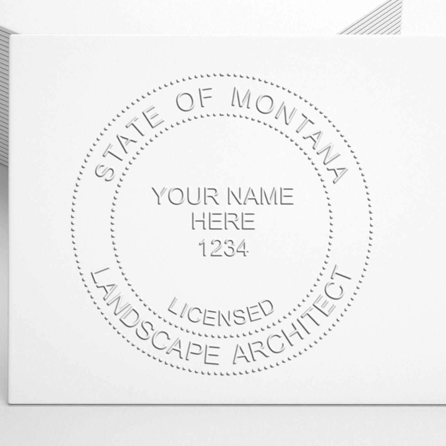 An alternative view of the Montana Long Reach Landscape Architect Embossing Stamp stamped on a sheet of paper showing the image in use